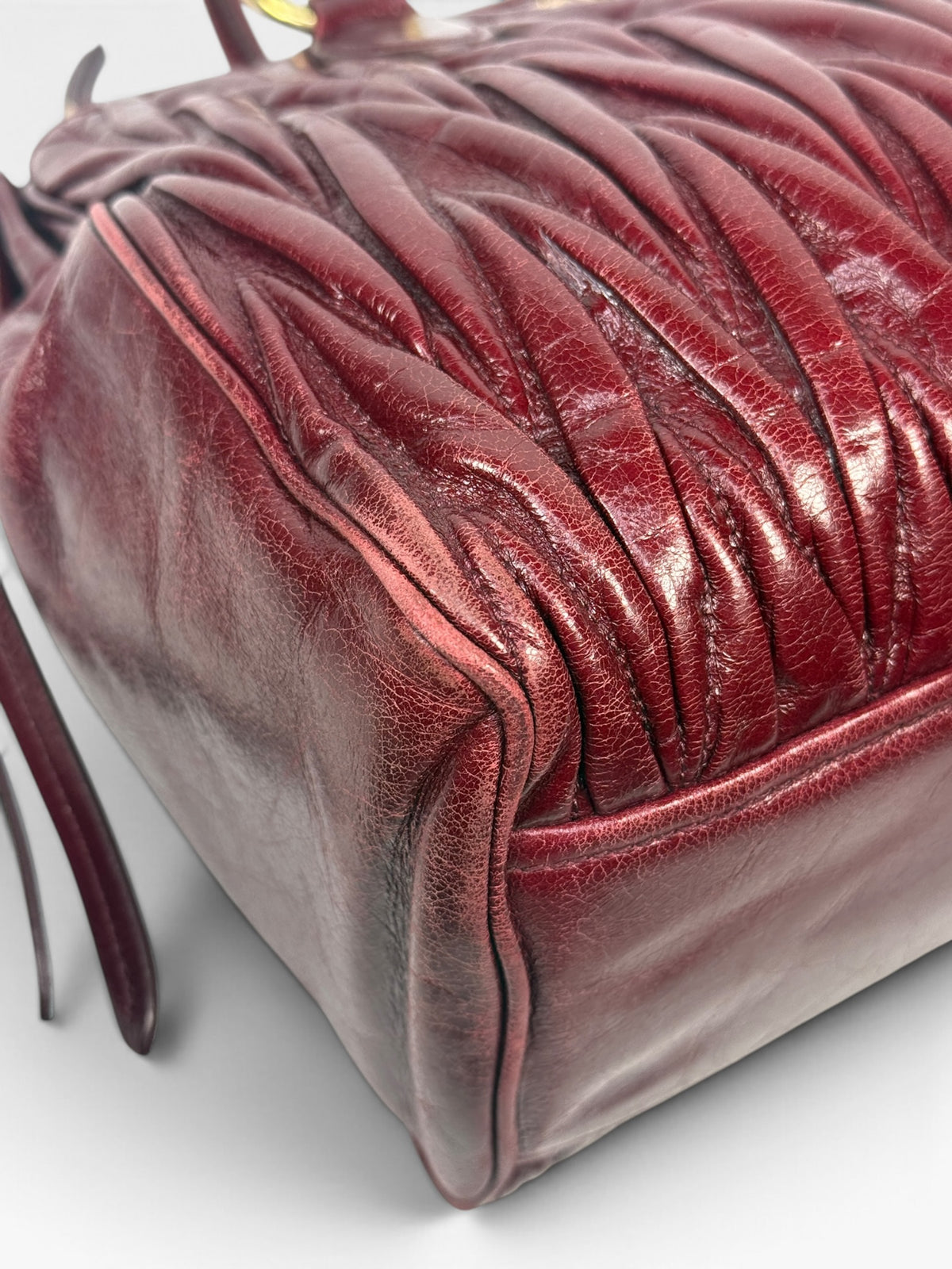 Miu Miu Bauletto Tote Bag In Burgundy Matelasse Leather With Gold Hardware. 100% authentic and pre loved in excellent condition.