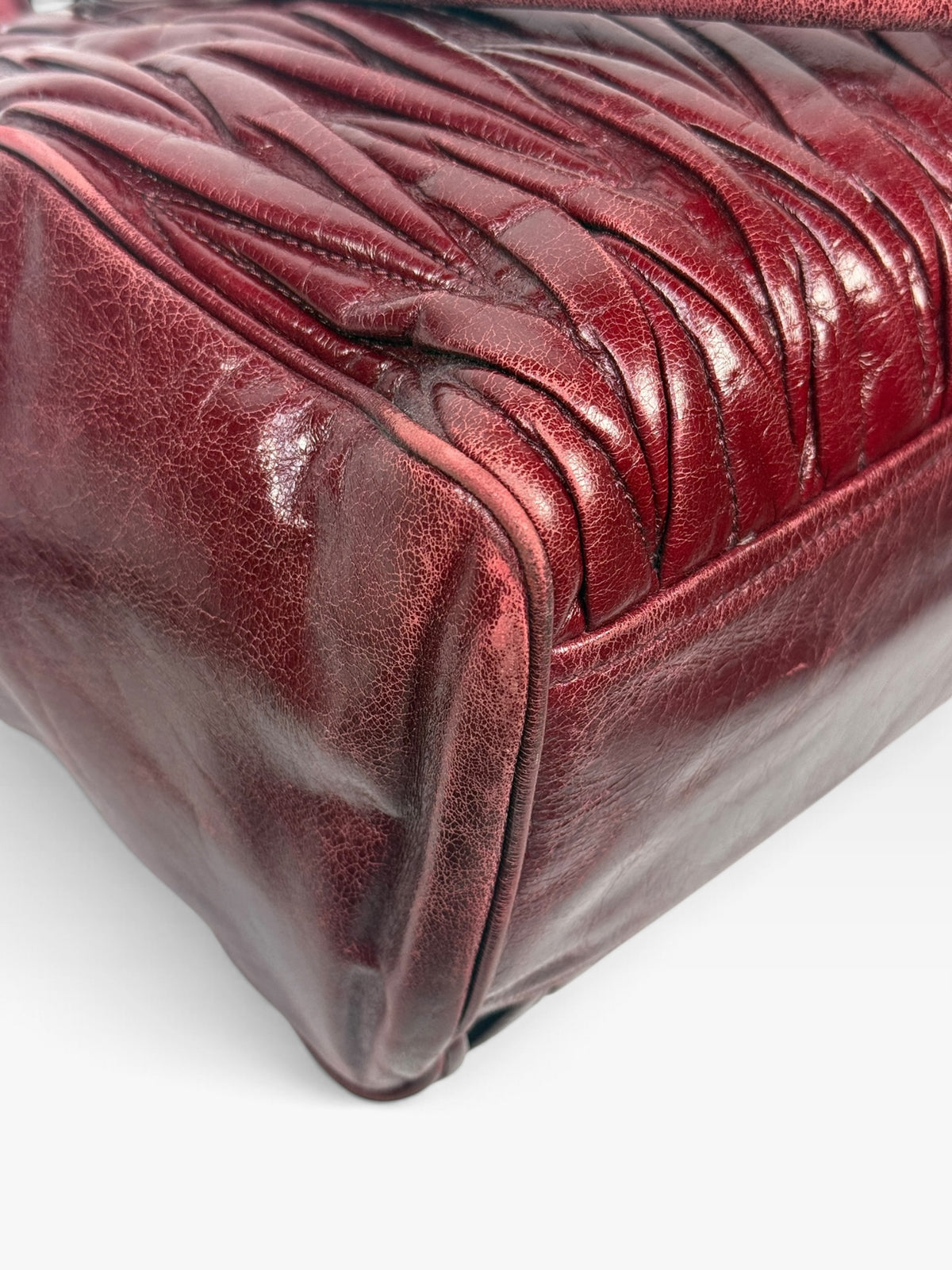 Miu Miu Bauletto Tote Bag In Burgundy Matelasse Leather With Gold Hardware. 100% authentic and pre loved in excellent condition.