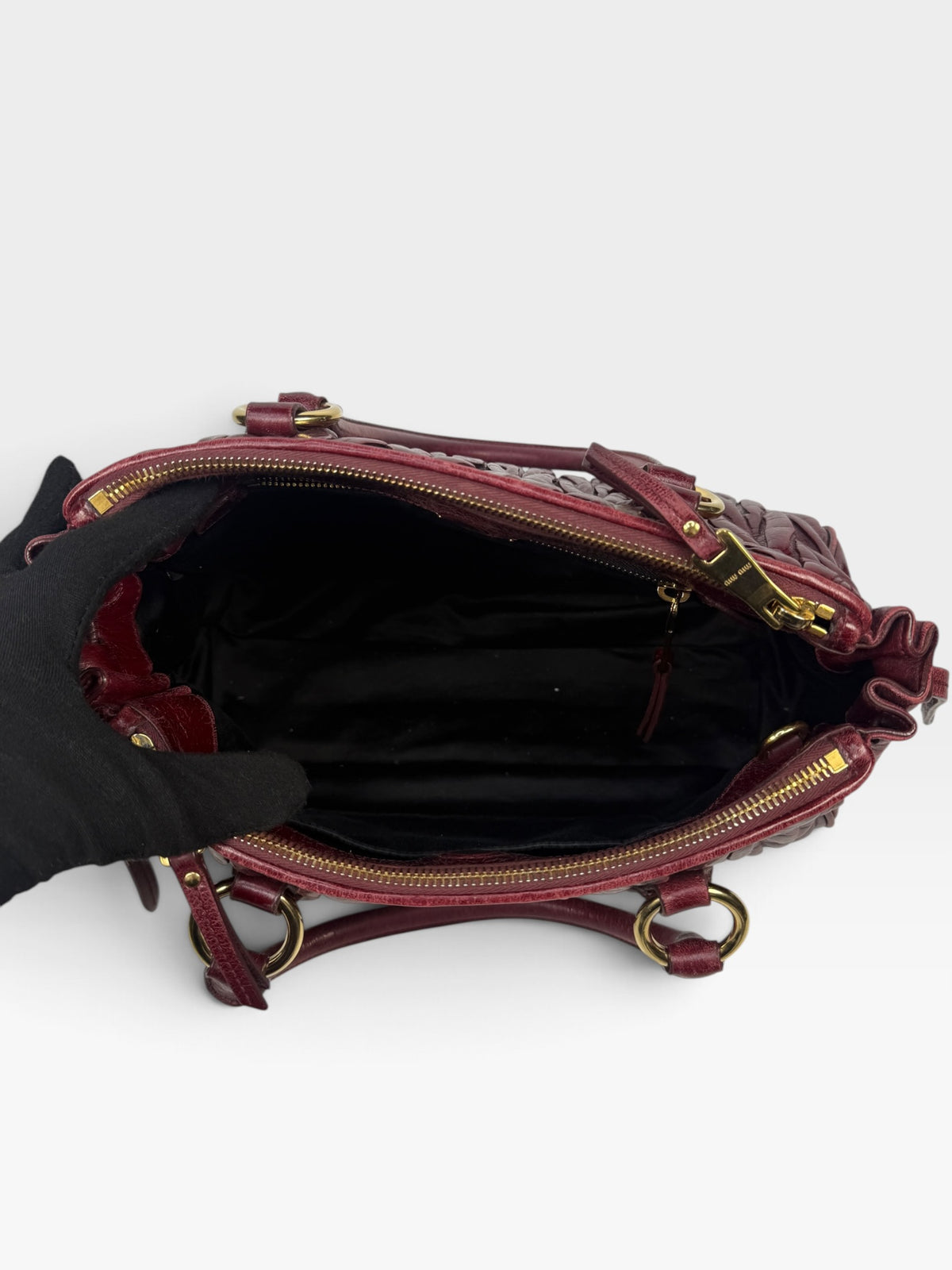 Miu Miu Bauletto Tote Bag In Burgundy Matelasse Leather With Gold Hardware. 100% authentic and pre loved in excellent condition.