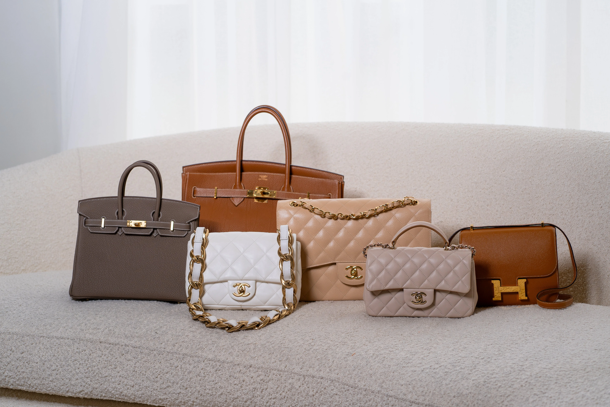 Expert authentication of a pre-loved designer handbag, examining craftsmanship and materials to verify authenticity