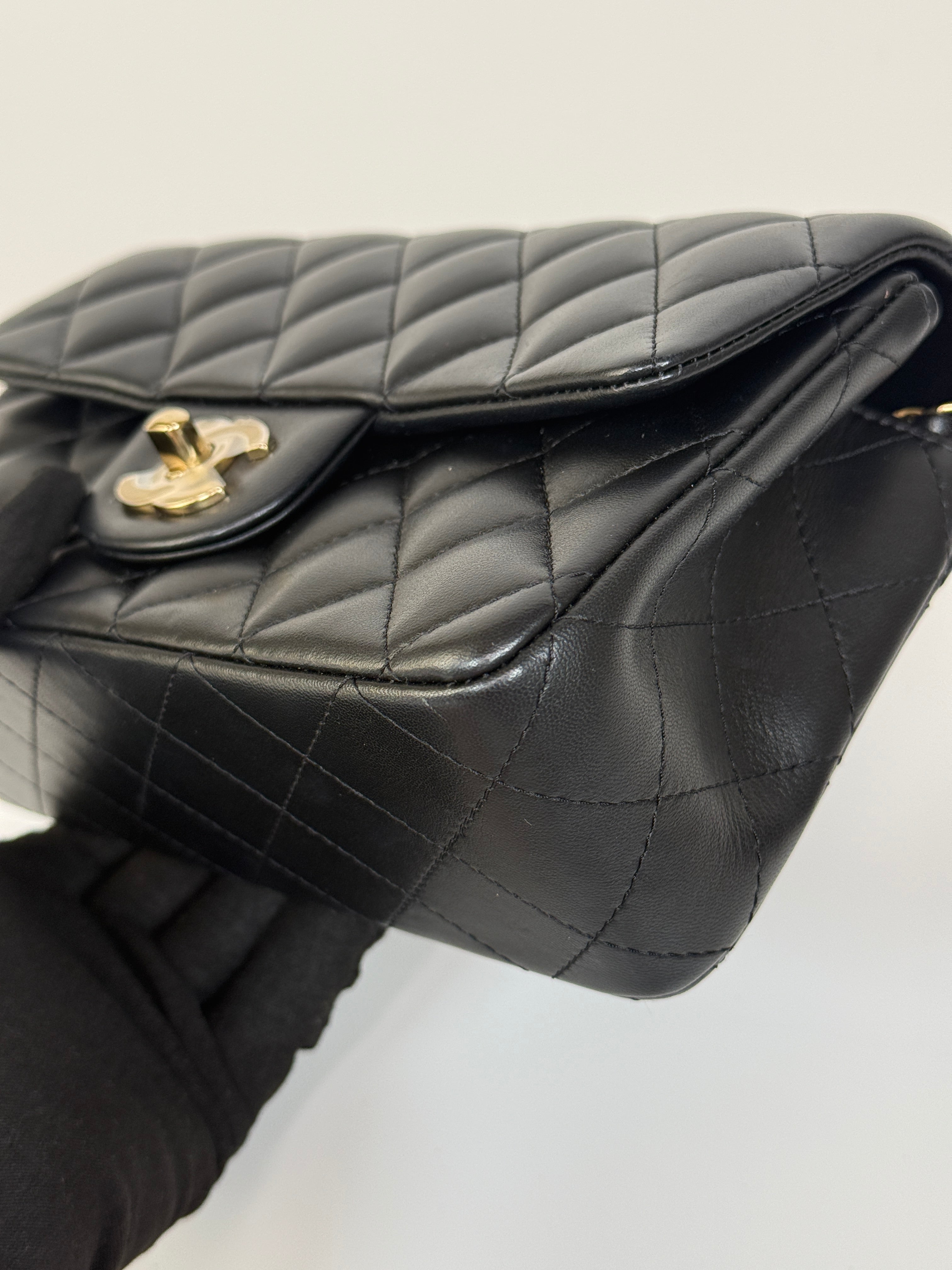 Authentic and preloved Chanel Mini Rectangle Top Handle Flap Bag In Black Lambskin With Gold hardware. Excellent Condition. 100% Authenticity guarantee 