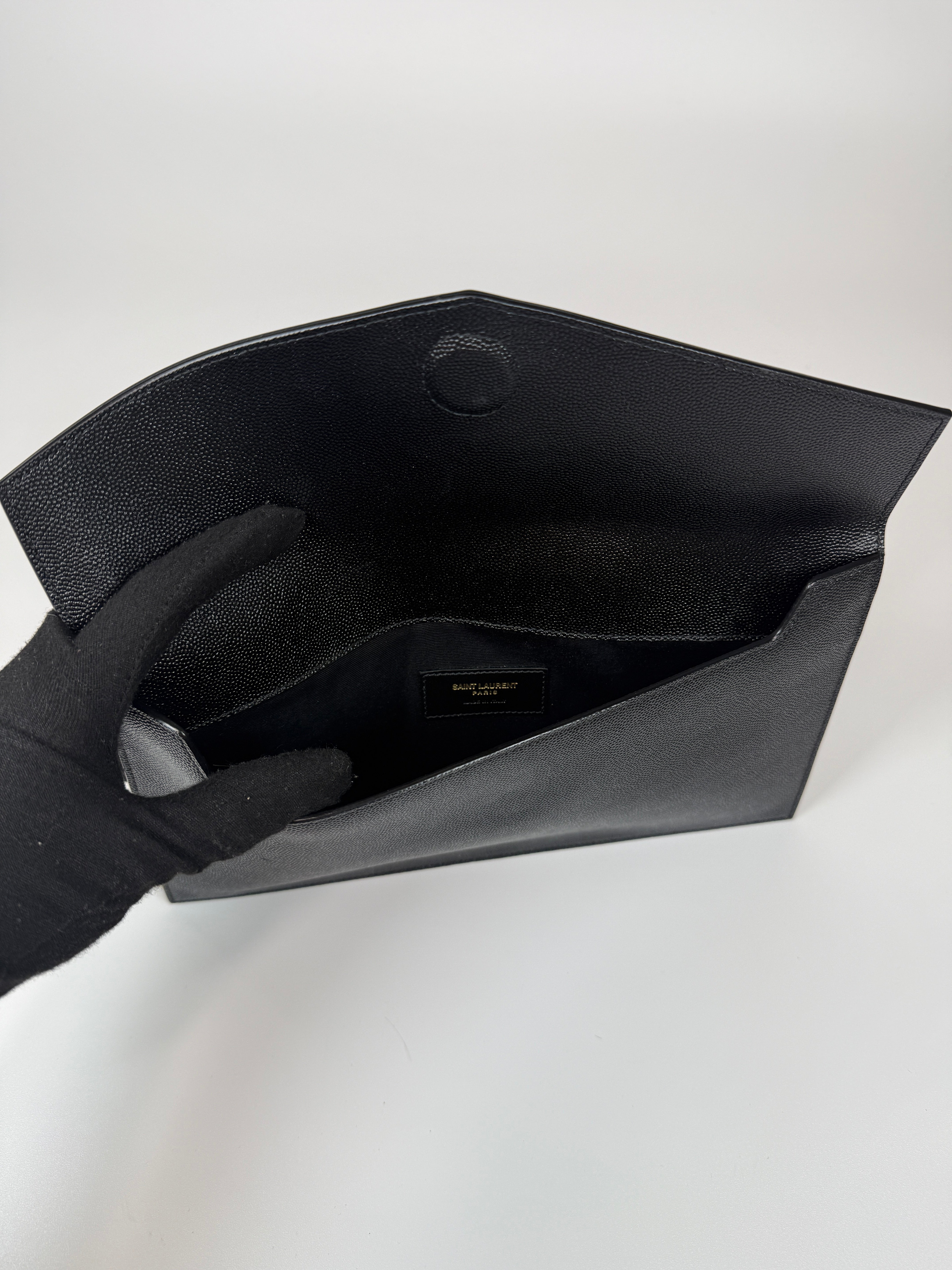 Saint Laurent Uptown Clutch In Black Leather With Gold Hardware. Authentic and preloved, 100% authenticity guarantee 