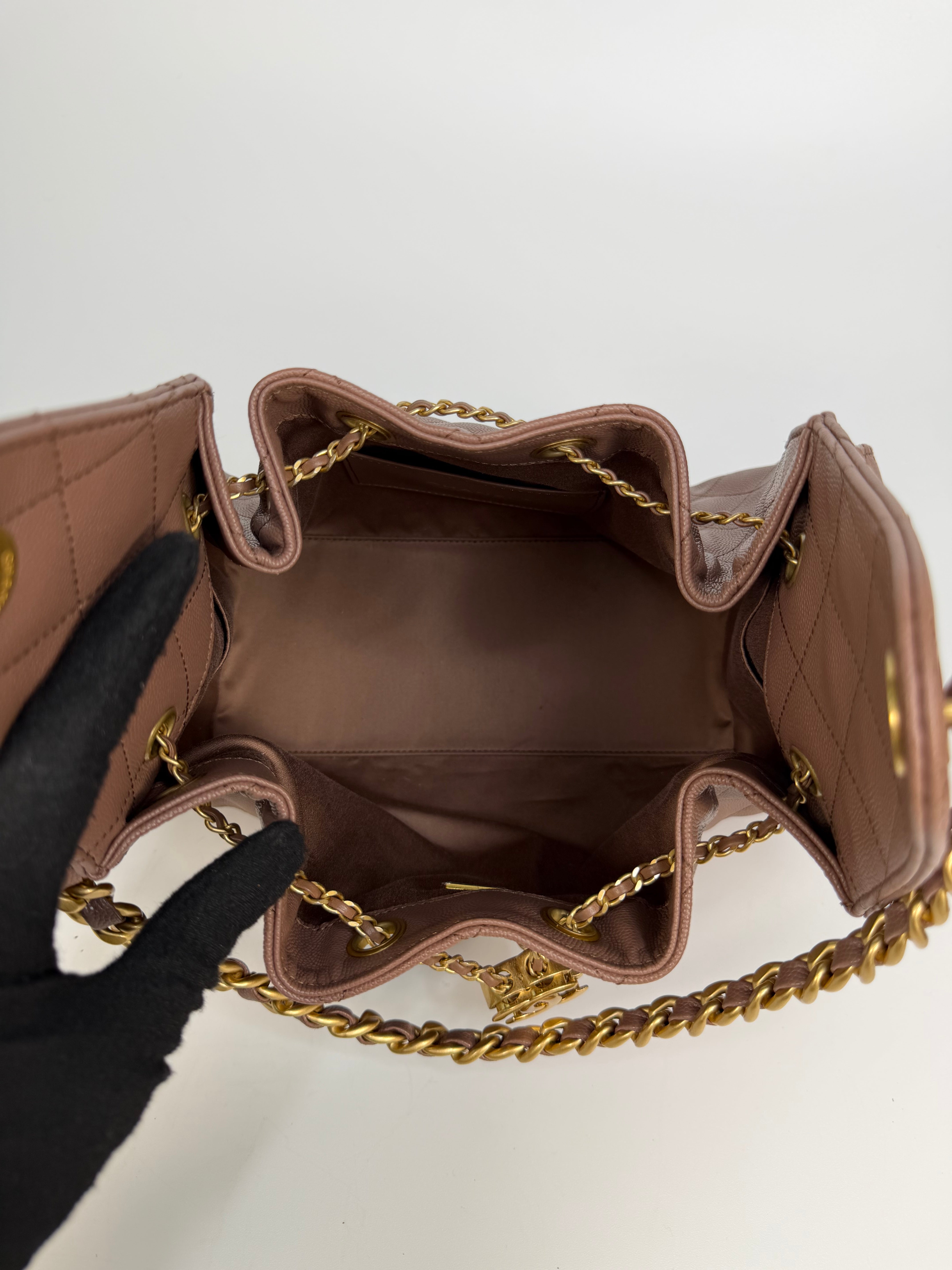 Chanel 25 Small In Brown Caviar Leather With Gold Hardware. Authentic and preloved in excellent condition