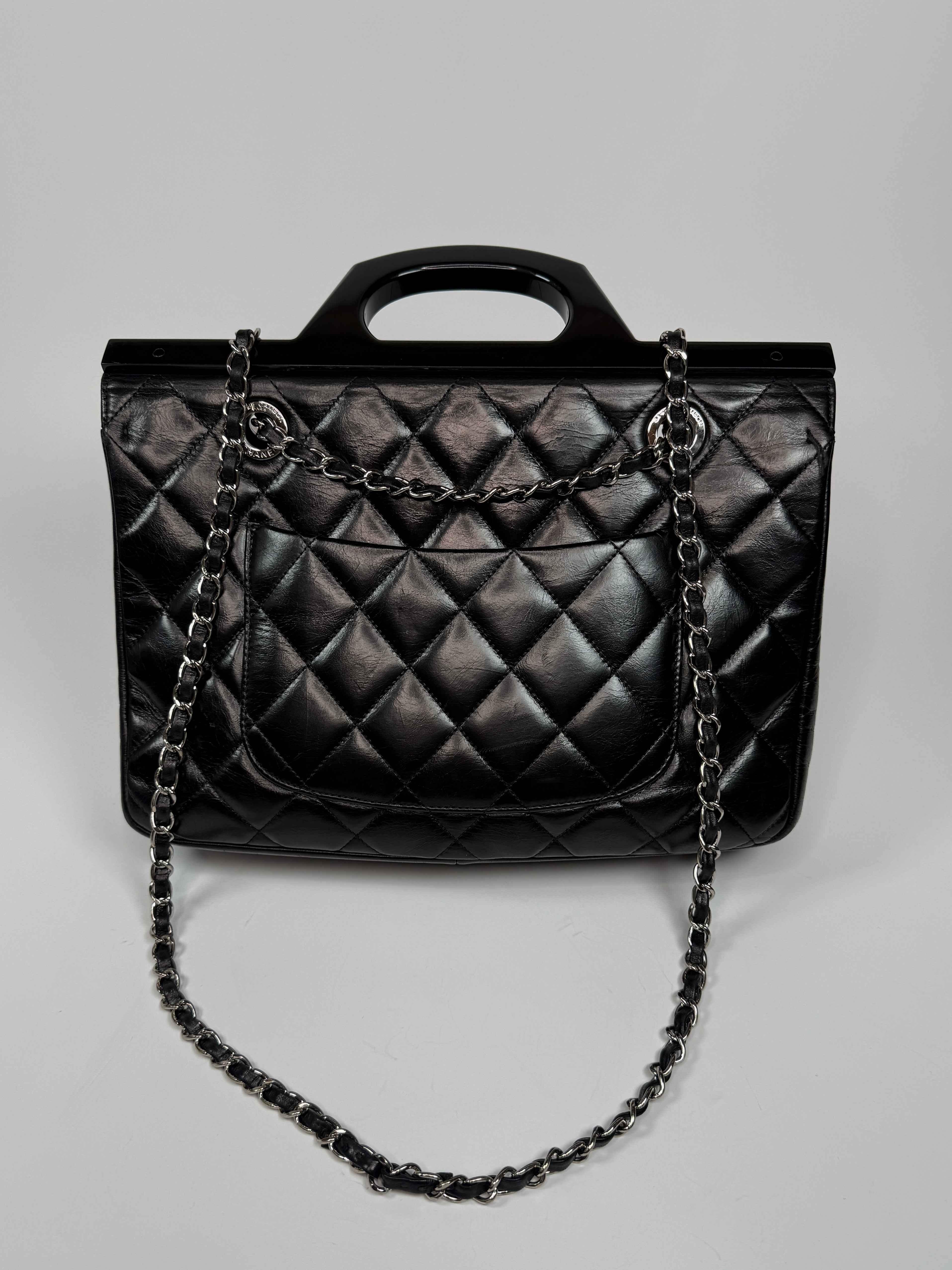 Chanel Delivery Top Handle Flap Bag In Black Calfskin Leather With Silver hardware in very good condition Authentic and preloved 