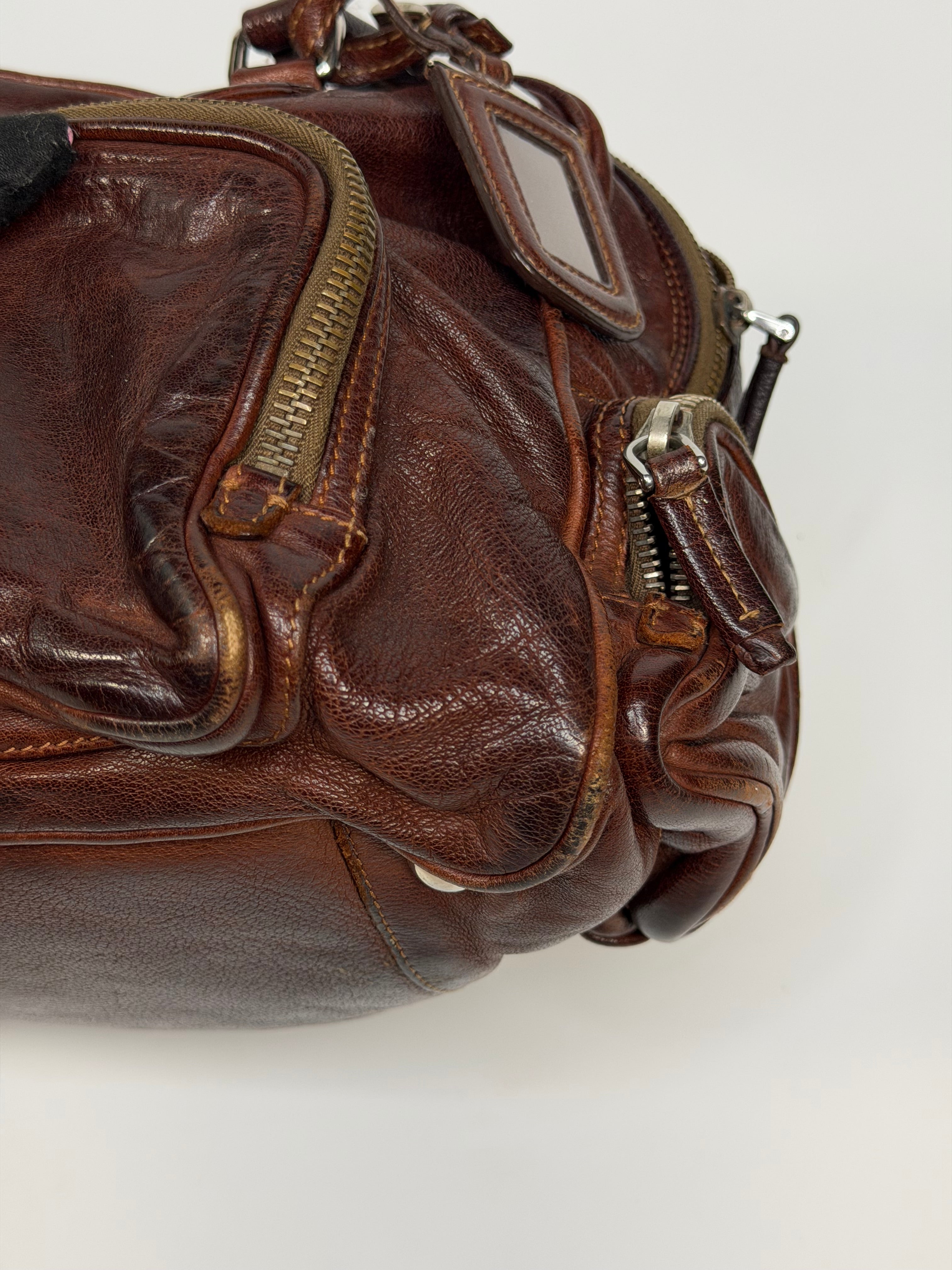 Prada Washed Bauletto Shoulder Bag In Brown Leather With Gold Hardware. Authentic and preloved in very good condition