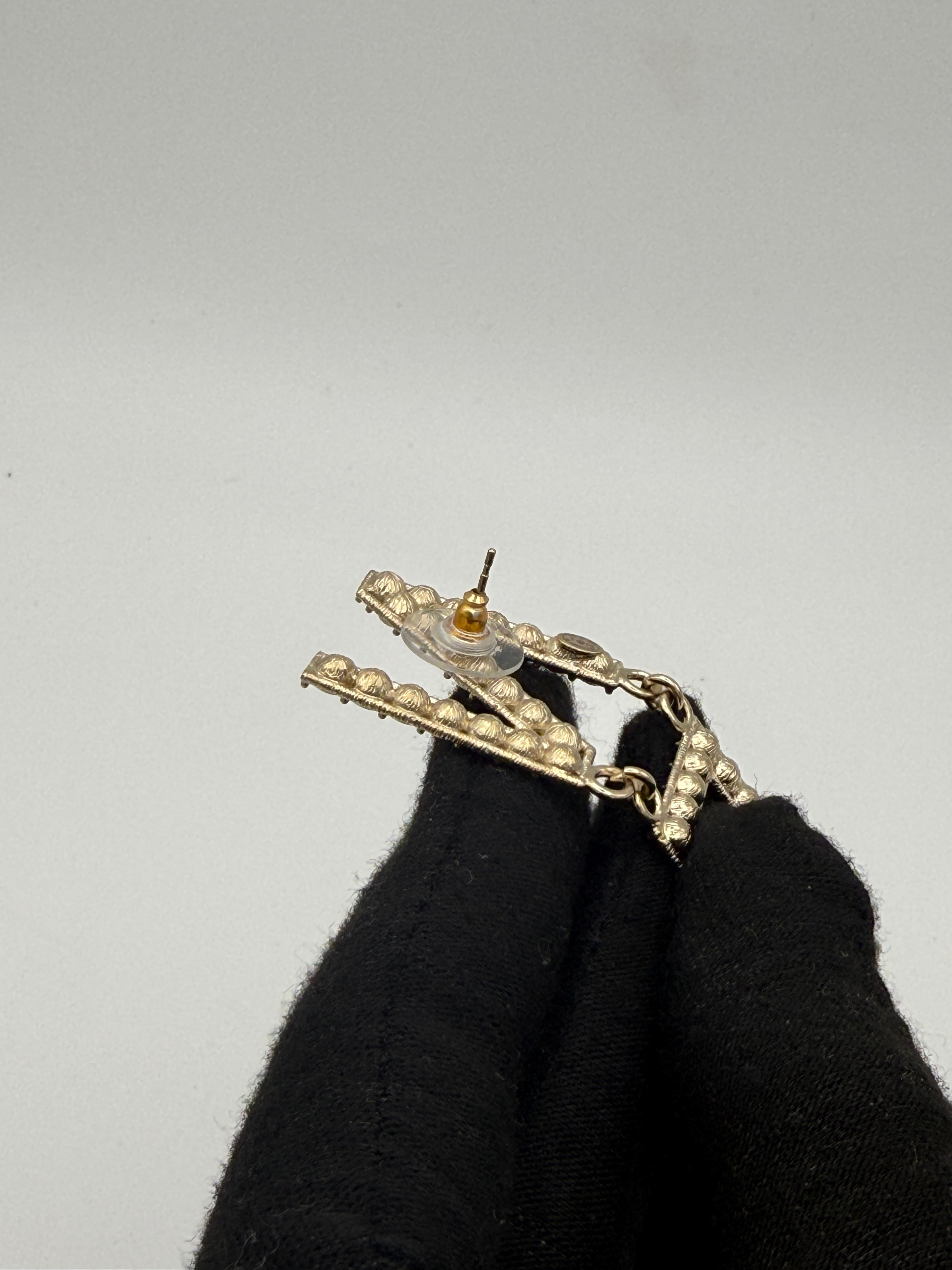 Authentic and preloved Chanel Crystal-Embellished Logo Earrings. 100% Authenticity Guarantee. Verified by Luxe Cheshire 