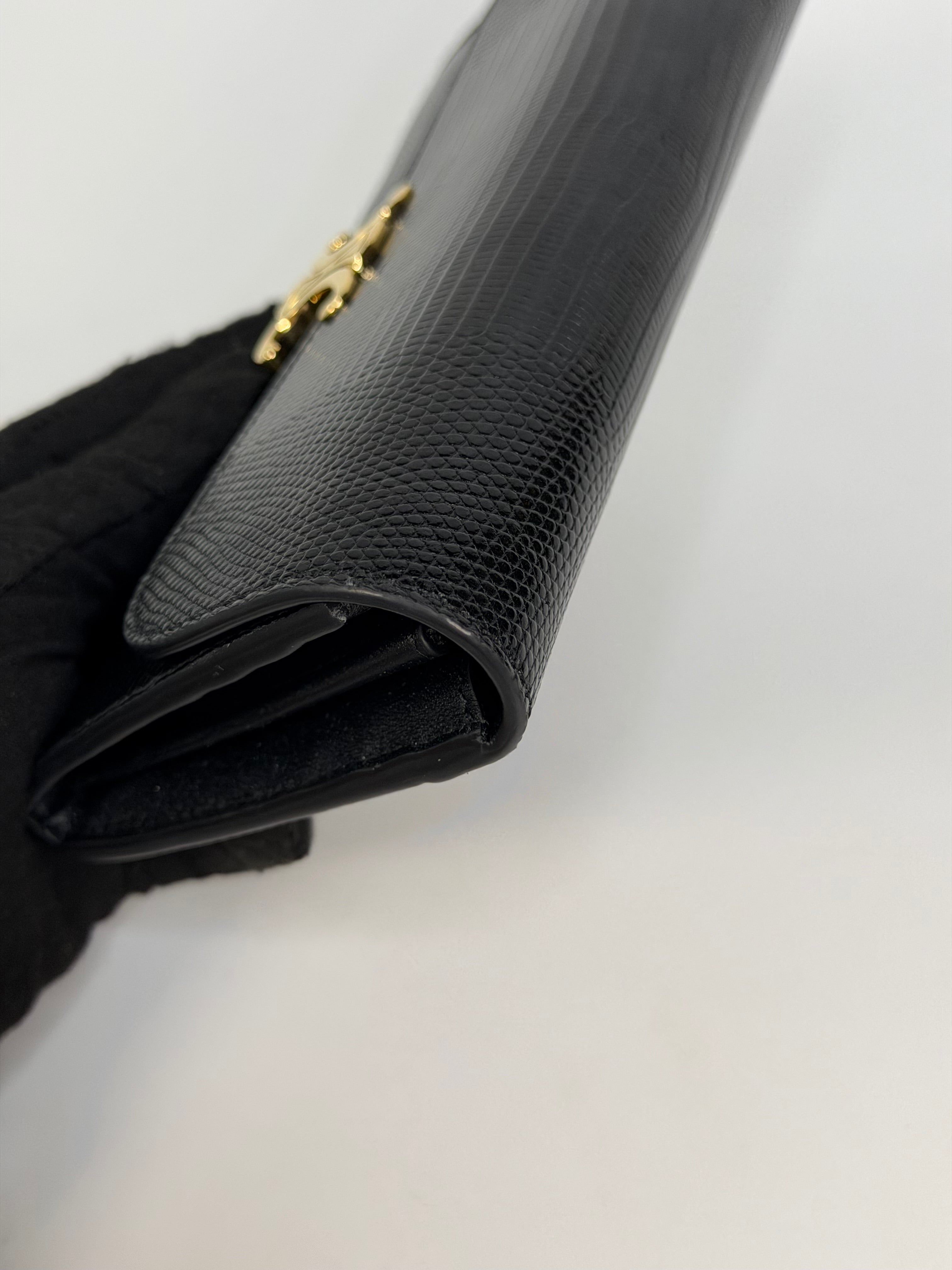 Celine Triomphe Wallet In Black Lizard Embossed Calfskin Gold Hardware. Authentic and preloved in excellent condition