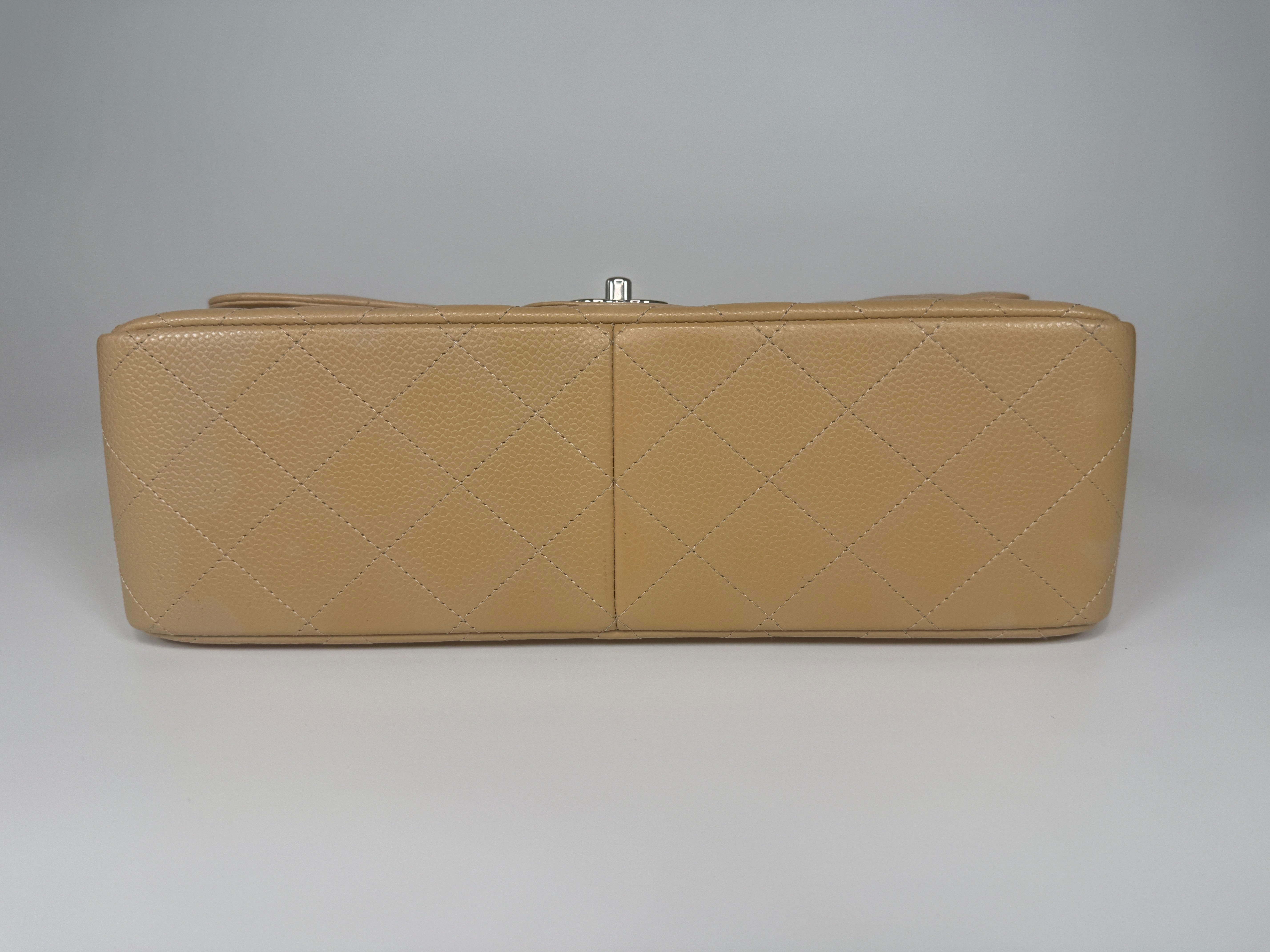 Authentic and preloved Chanel Jumbo Classic Flap Bag In Beige Caviar Leather With Silver Hardware. 100% Authenticity guarantee. Verified by Luxe Cheshire. Fully Insured next day delivery 
