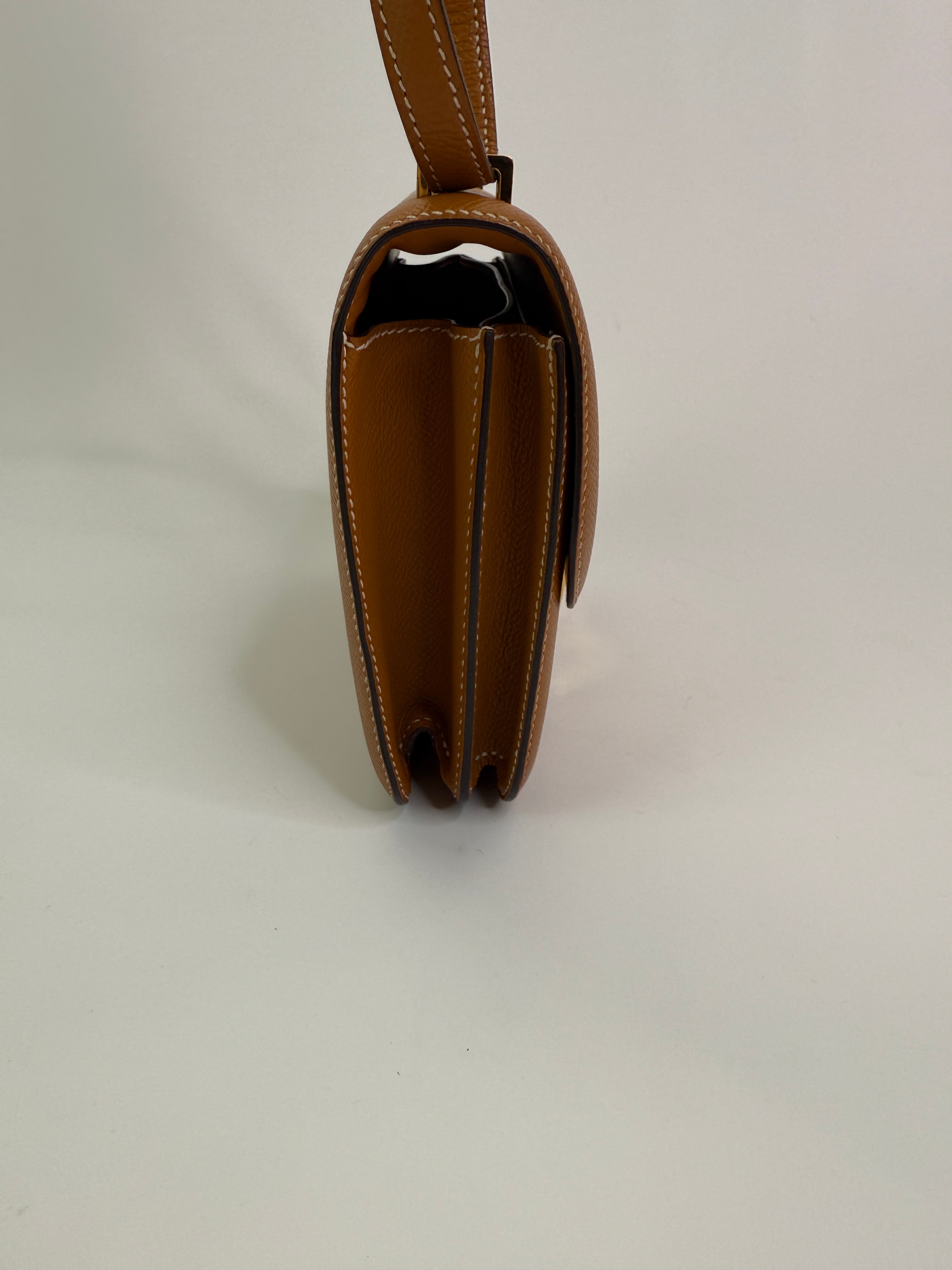 Authentic pre-lovedHermès Constance 18 In Toffee Epsom Leather With Gold Hardware. 