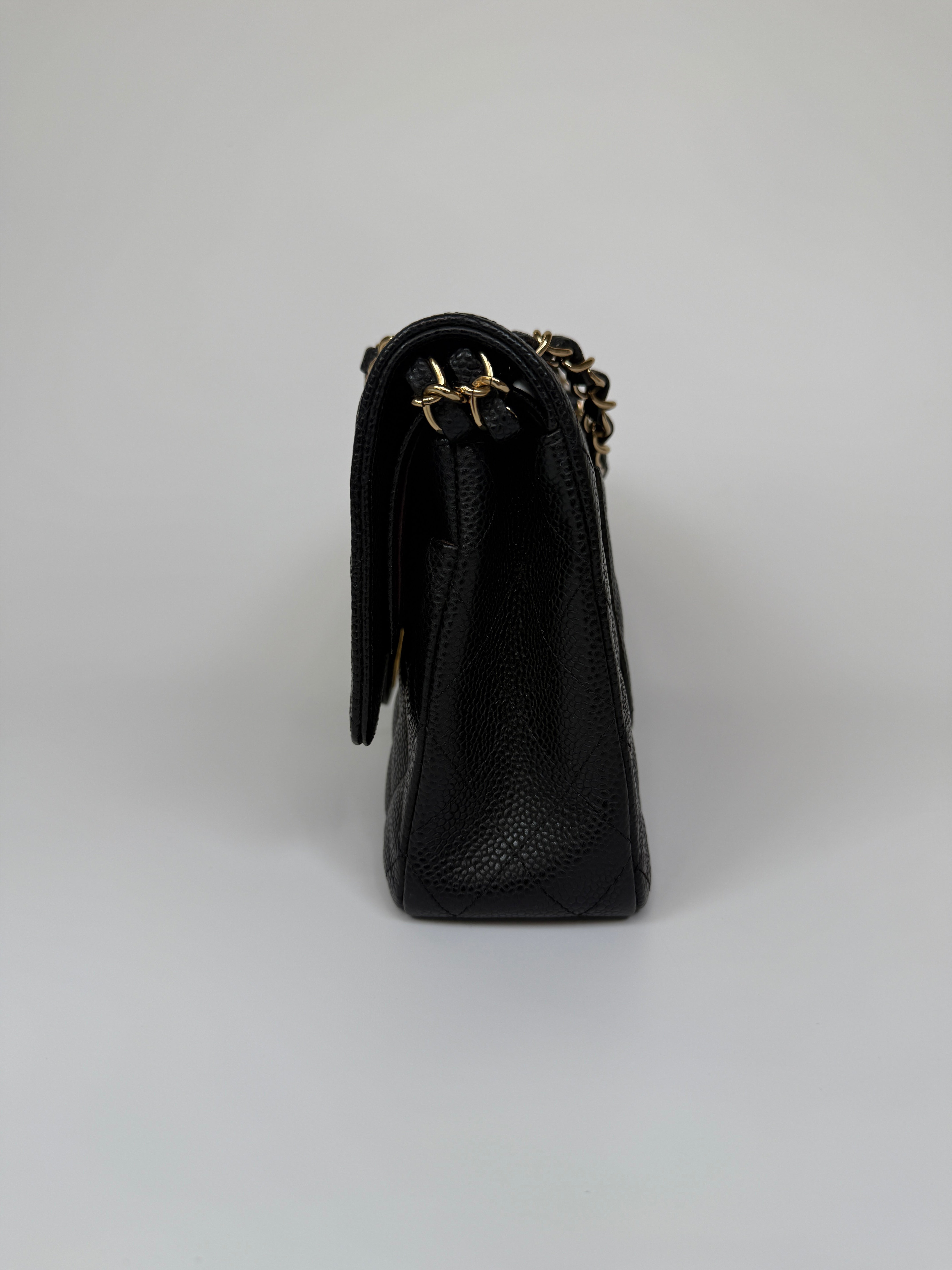 Chanel Medium Classic Double Flap Black Caviar Leather With Gold Hardware. Authentic and preloved. 100% Authenticity guarantee 