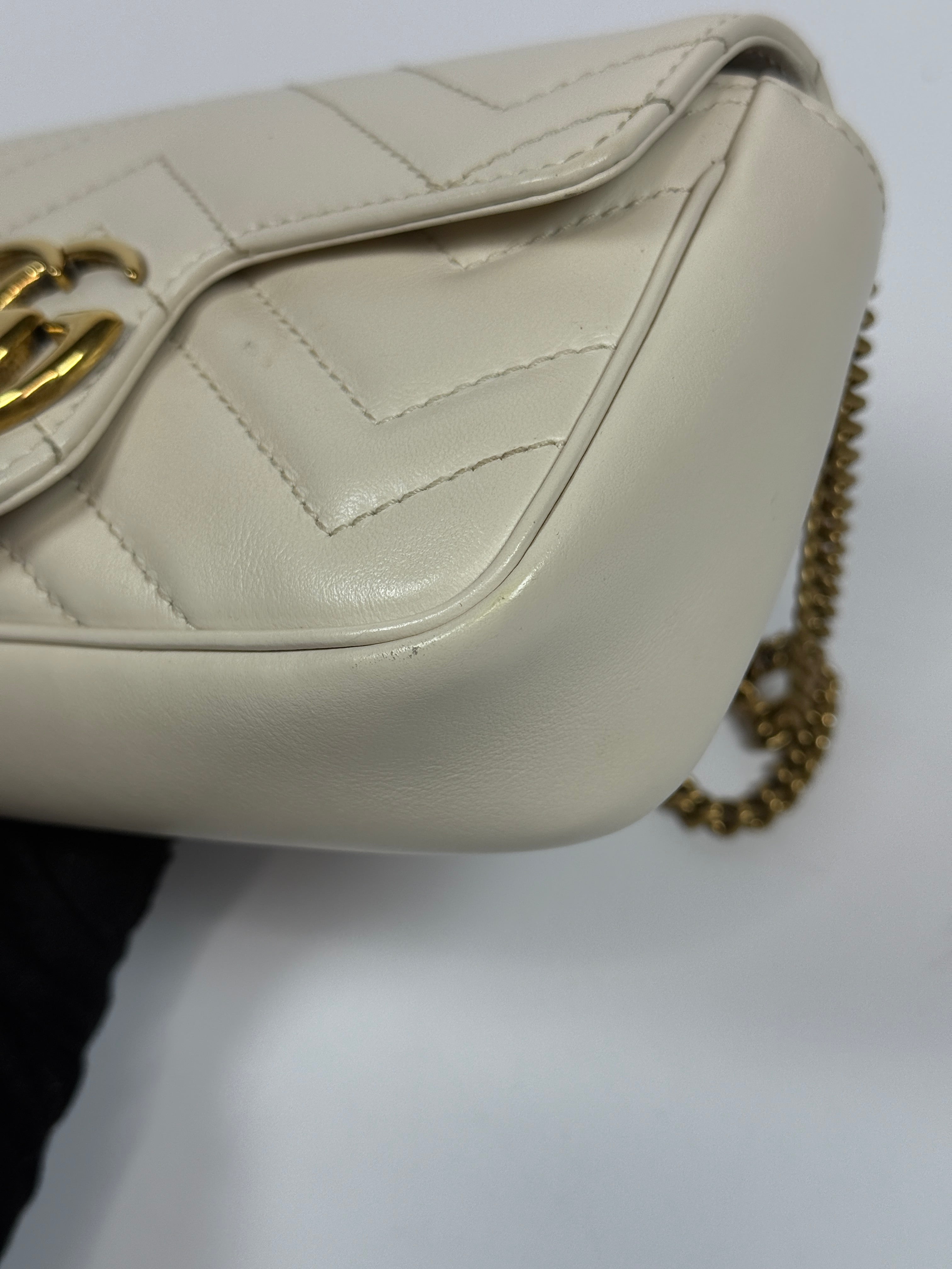 Gucci Marmont White  Matelassé Super Mini Bag With Gold Hardware In Excellent pre loved condition. Authentic and preloved