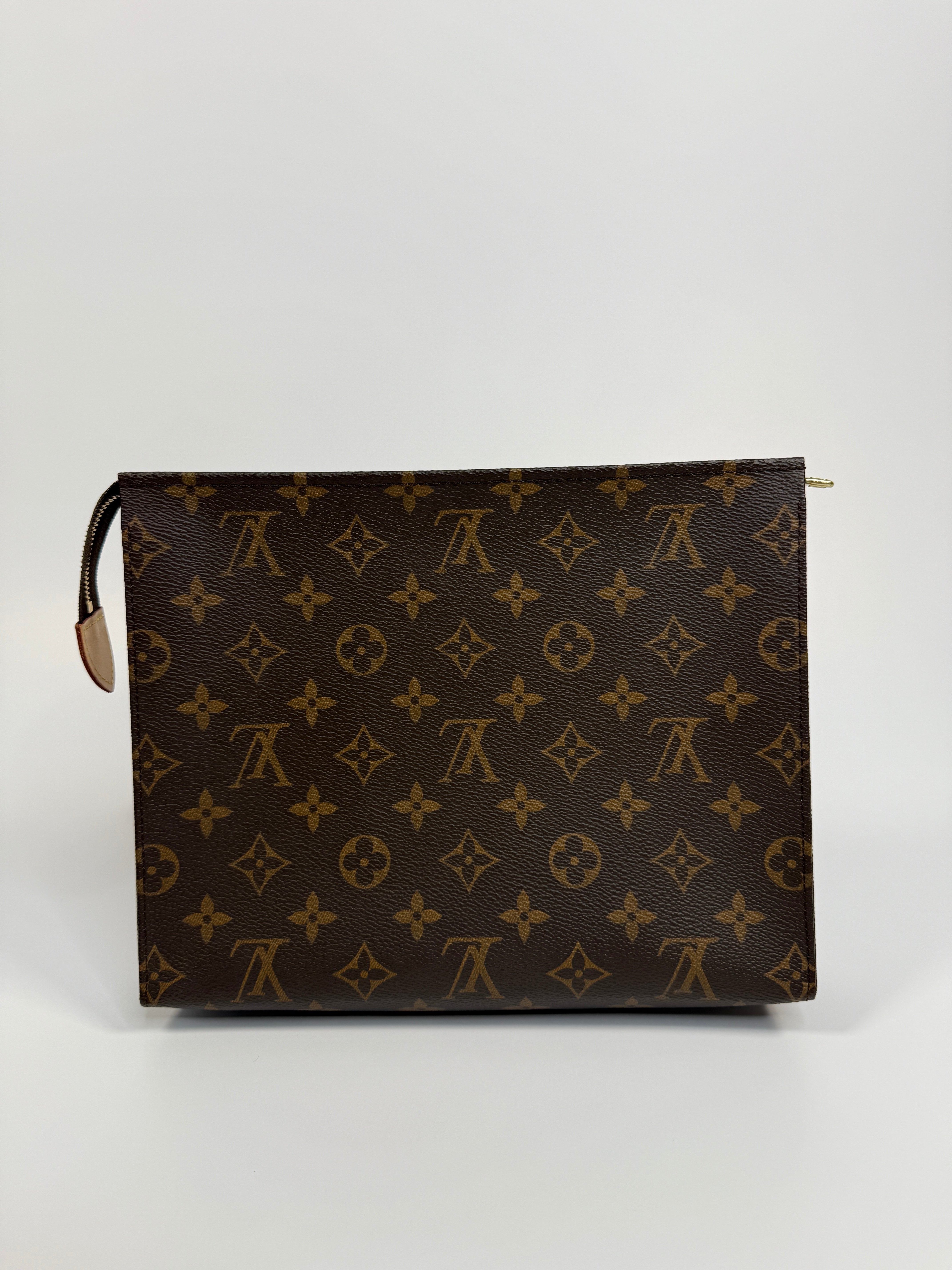 Authentic and preloved Louis Vuitton Monogram Toiletry 26 Pouch In Brown Monogram With Gold Hardware in excellent condition