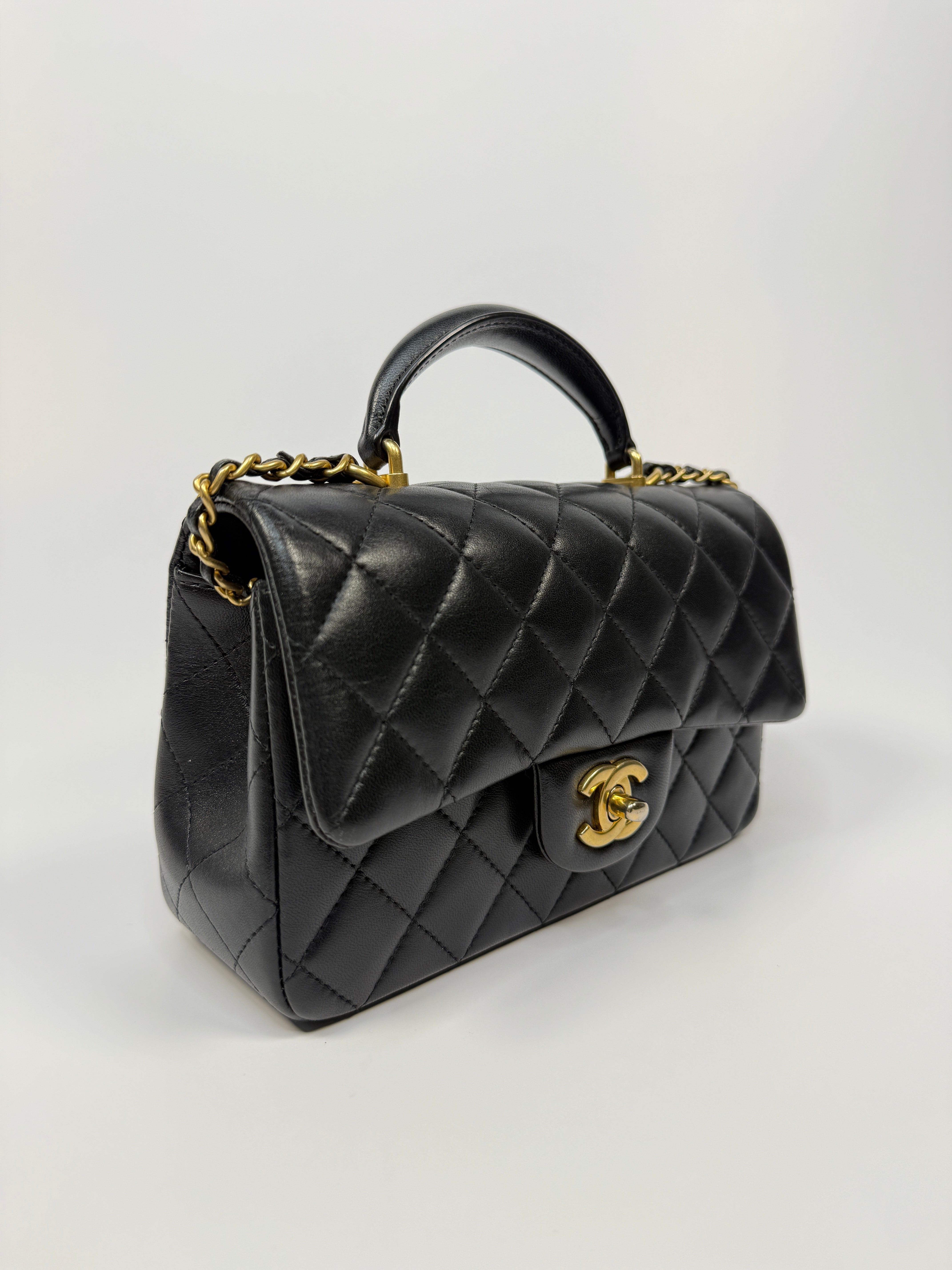 Chanel Mini Rectangle Top Handle Flap Bag In Black Lambskin With Gold Hardware
Pre Loved & Authentic 