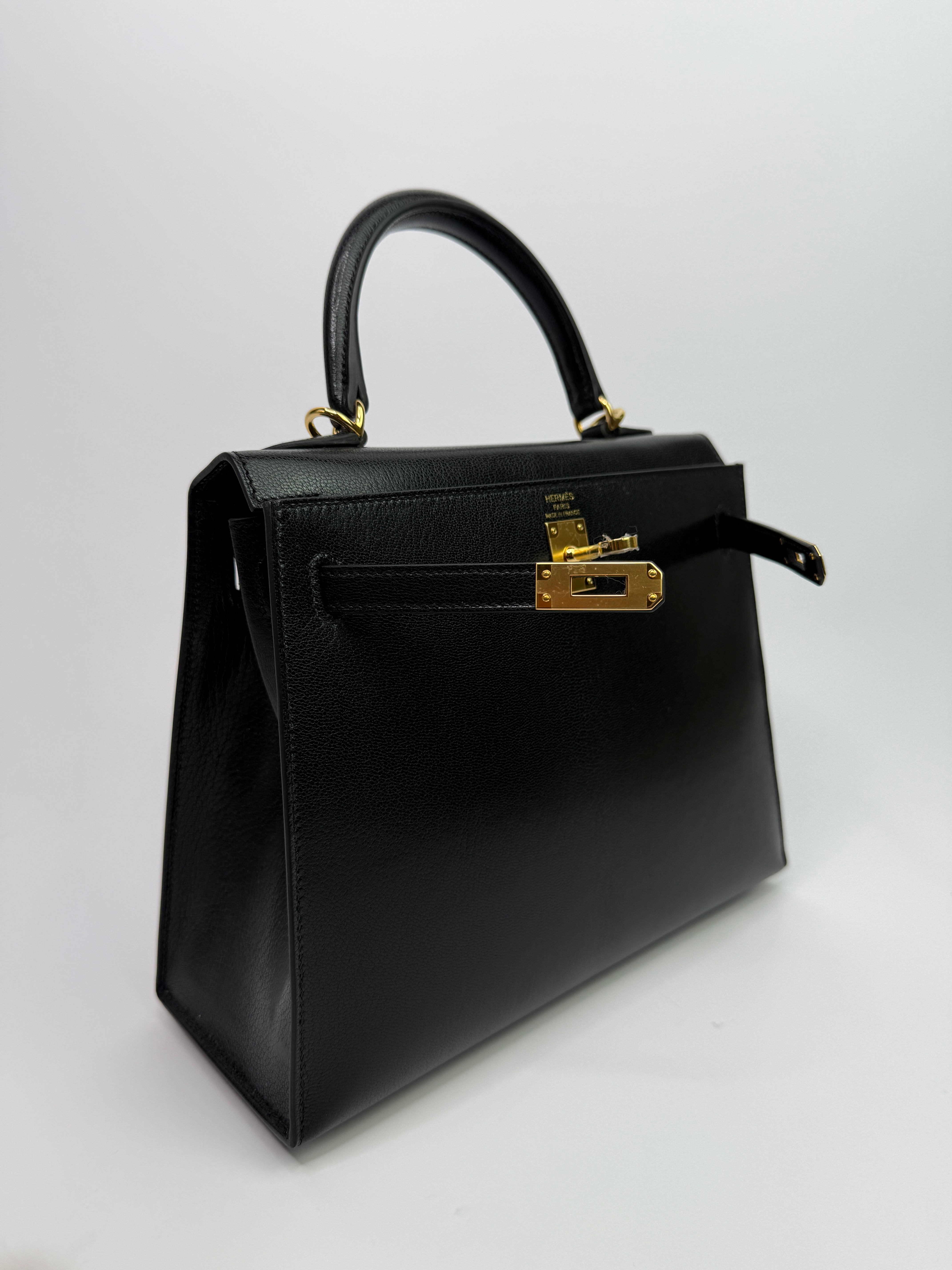 Authentic Pre Loved Hermès Kelly 25 Sellier In Black Chevre Chamilka Leather with Yellow Gold Hardware New & Unused Condition