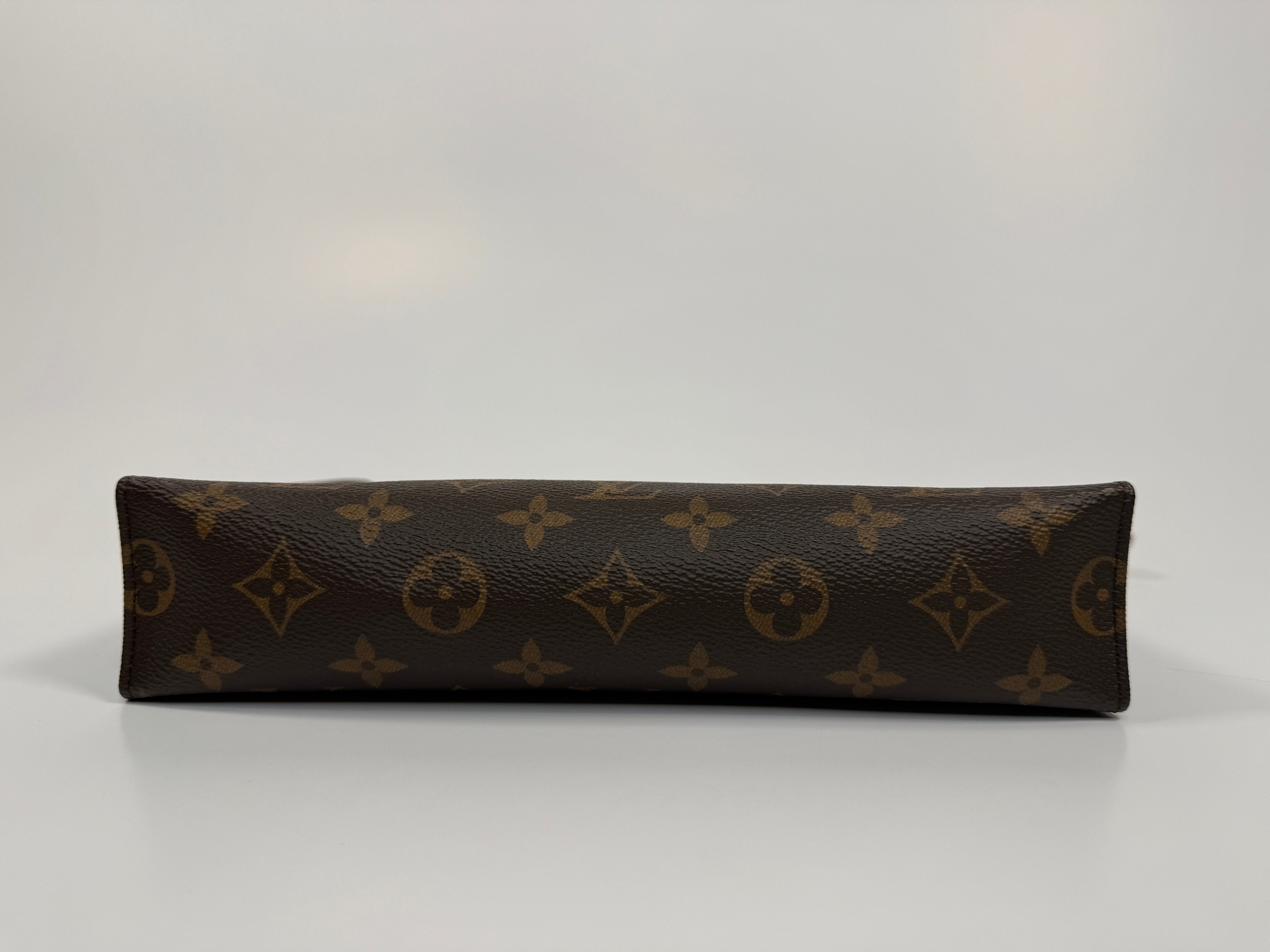 Authentic and preloved Louis Vuitton Monogram Toiletry 26 Pouch In Brown Monogram With Gold Hardware in excellent condition