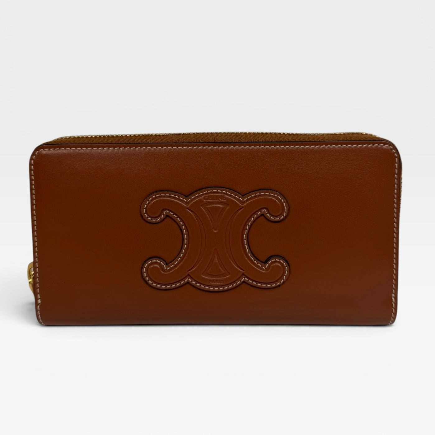 Celine Triomphe Long Wallet In Tan Calfskin With Gold Hardware. Authentic and preloved in excellent condition