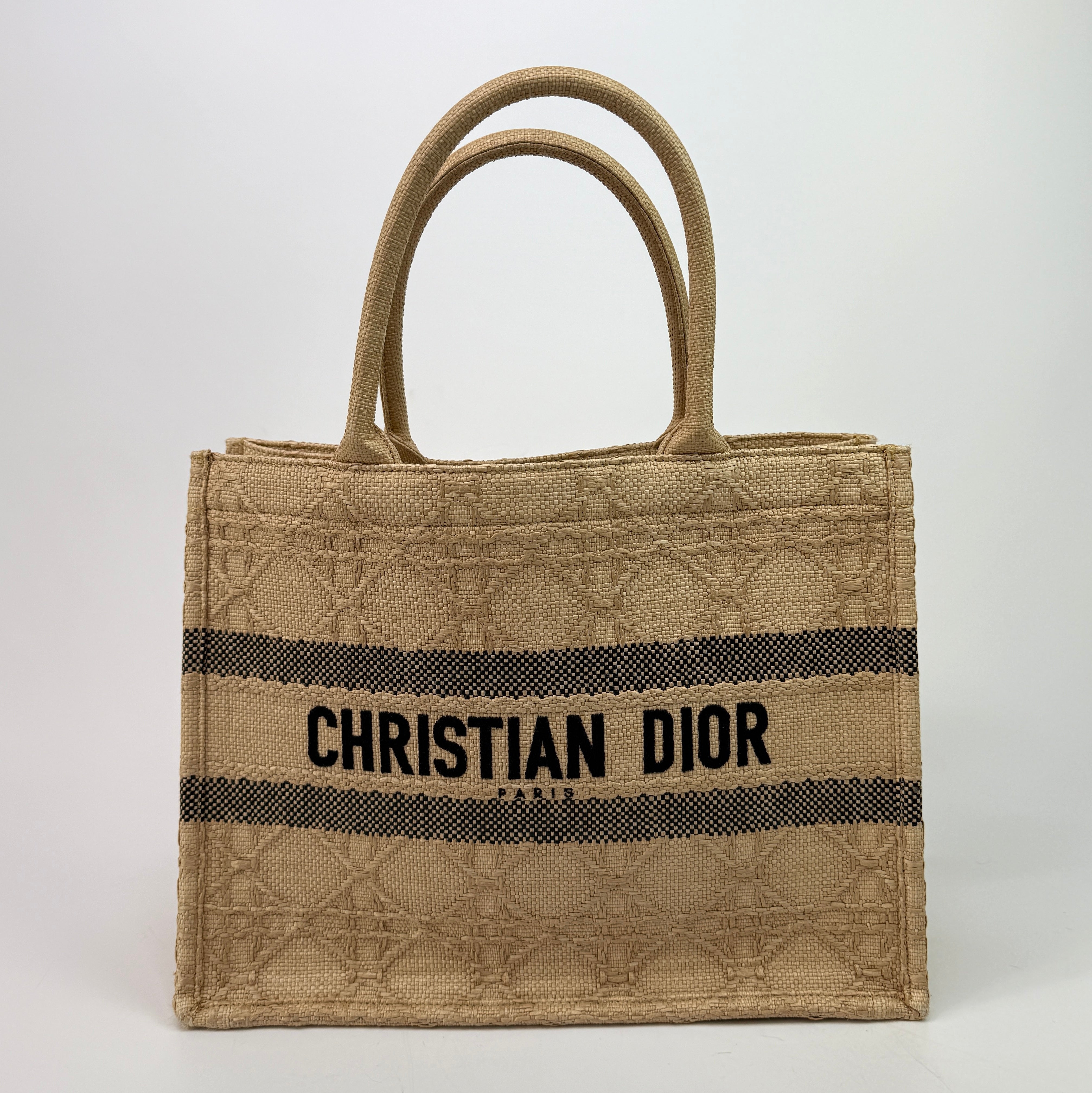 Authentic pre-loved Christian Dior Medium Raffia Cannage Book Tote. 