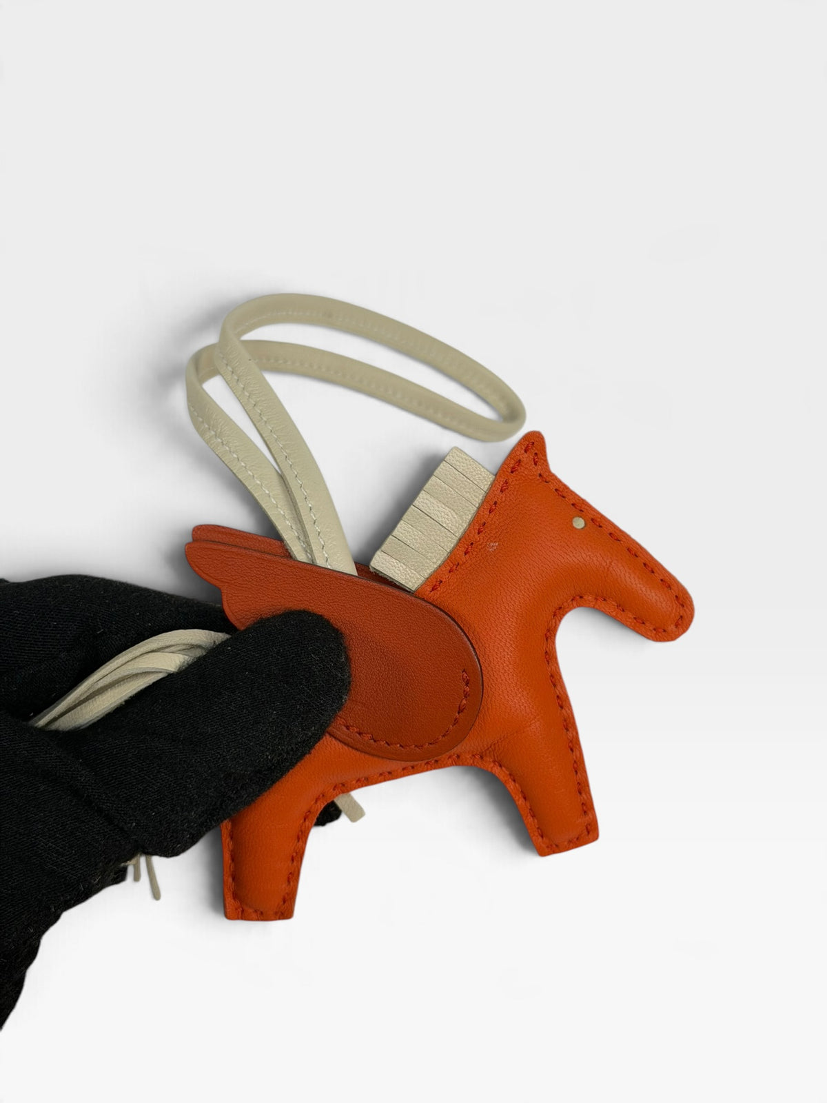 Hermès Rodeo Pegasus Charm In Orange Poppy, Craie & Terre Battue. 100% authentic and pre loved in excellent condition. 
