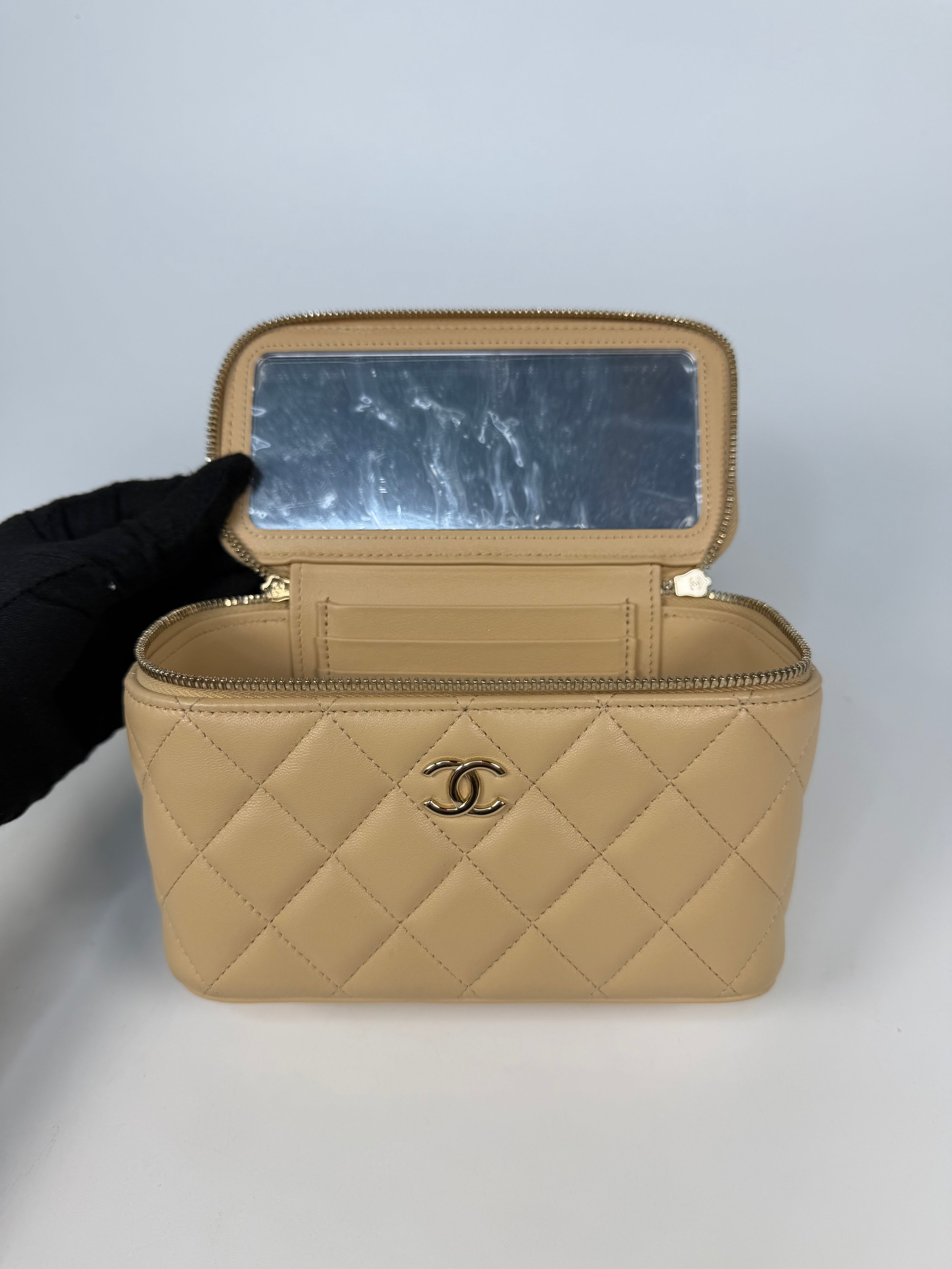 Chanel Mini Vanity Top Handle In Light Beige Lambskin Leather With Gold Hardware. Authentic and preloved in excellent condition. Insured next day delivery. Verified by Luxe Cheshire