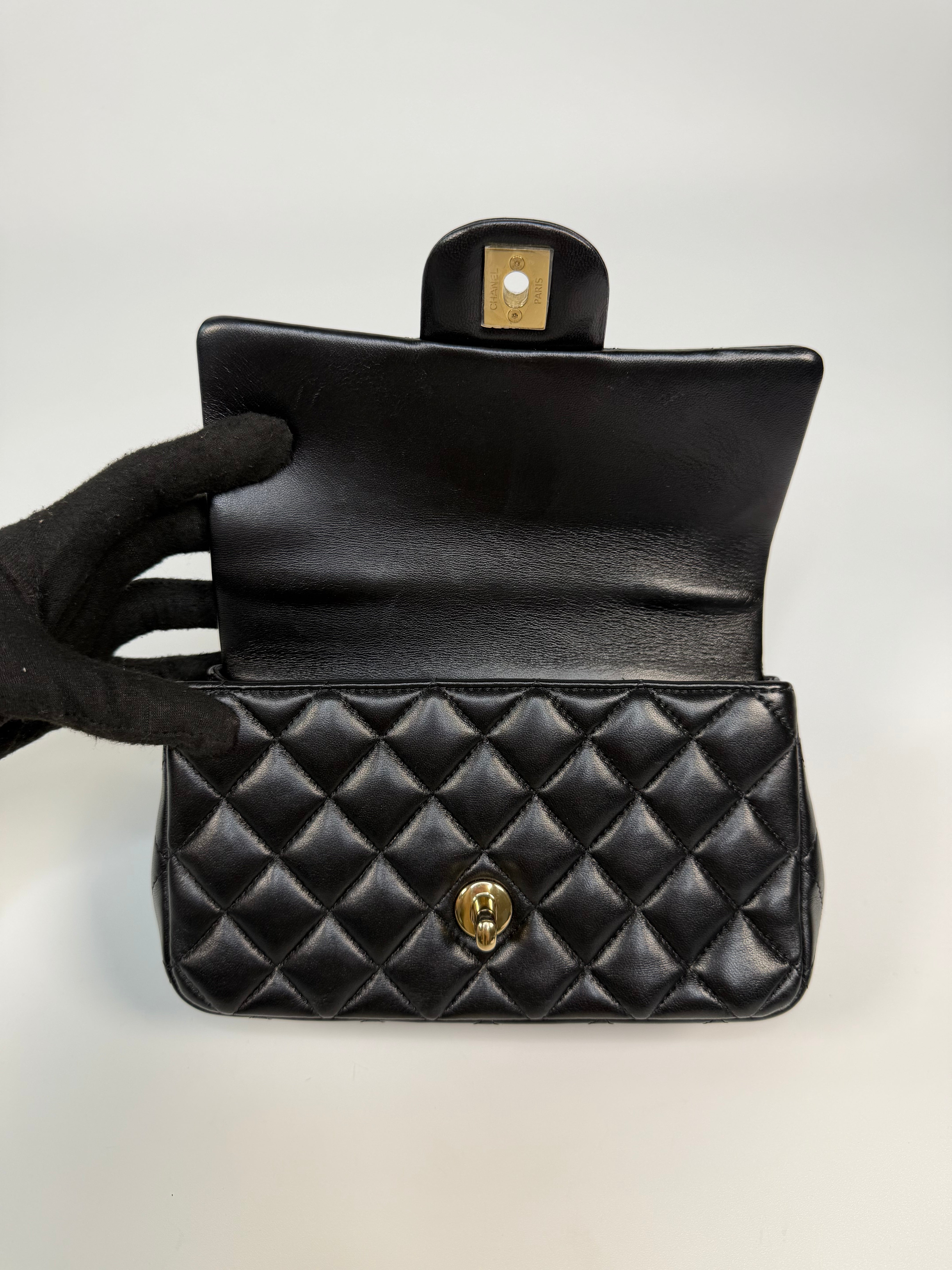 Chanel Mini Rectangle Top Handle In Black Lambskin Leather With Pale Gold Hardware. Authentic and preloved in excellent condition.