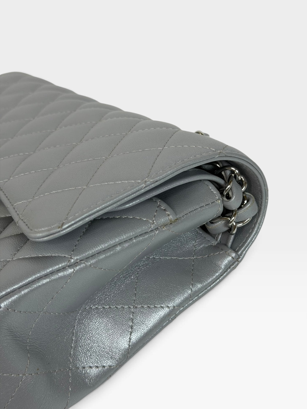 Chanel Medium Classic Double Flap In Silver Lambskin Leather Silver Hardware. 100% authentic and preloved in excellent condition
