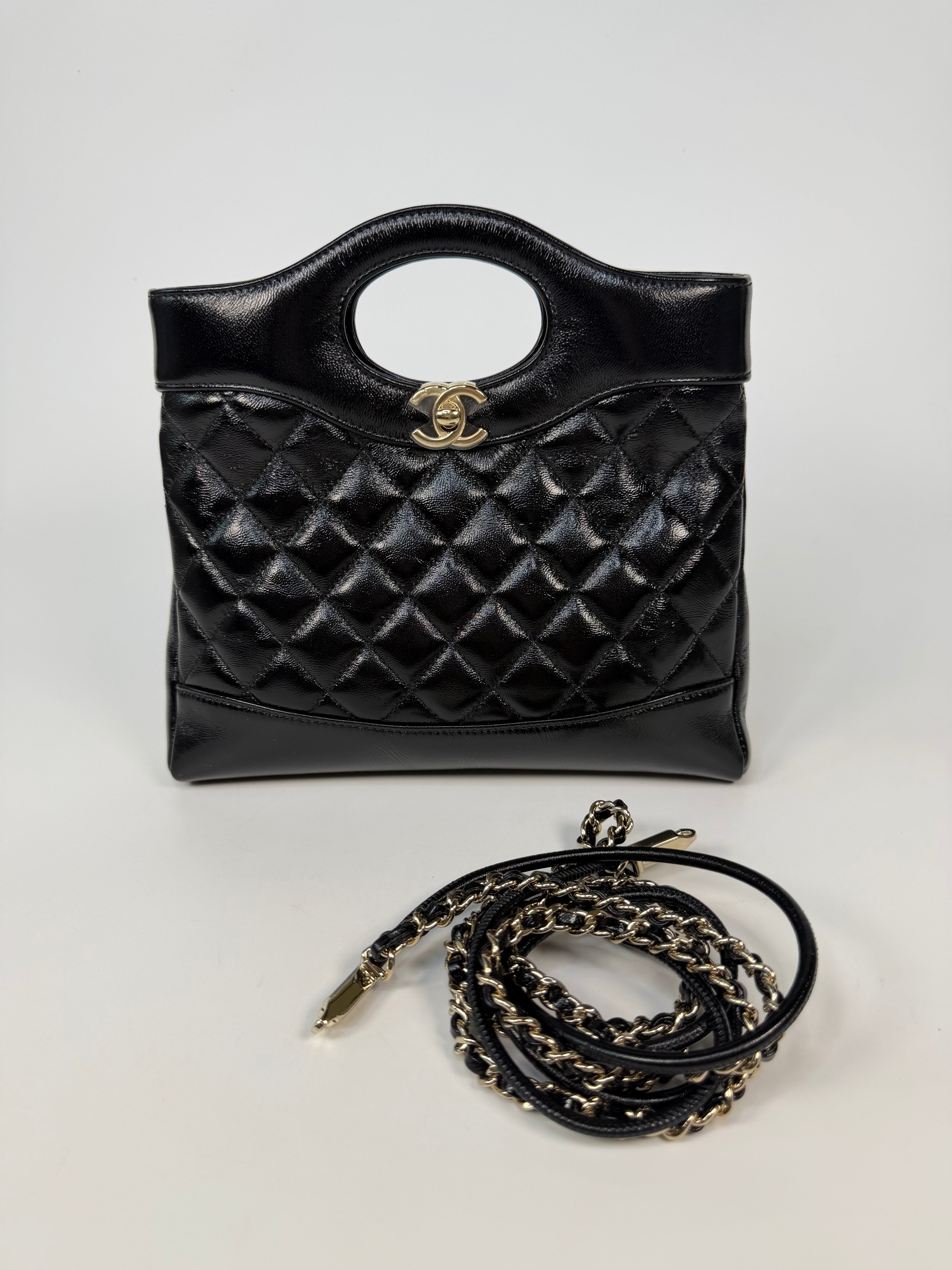 Chanel 31 Small In Black Calfskin Leather With Pale Gold Hardware
Excellent Condition, verified by Luxe Cheshire. Authentic and preloved