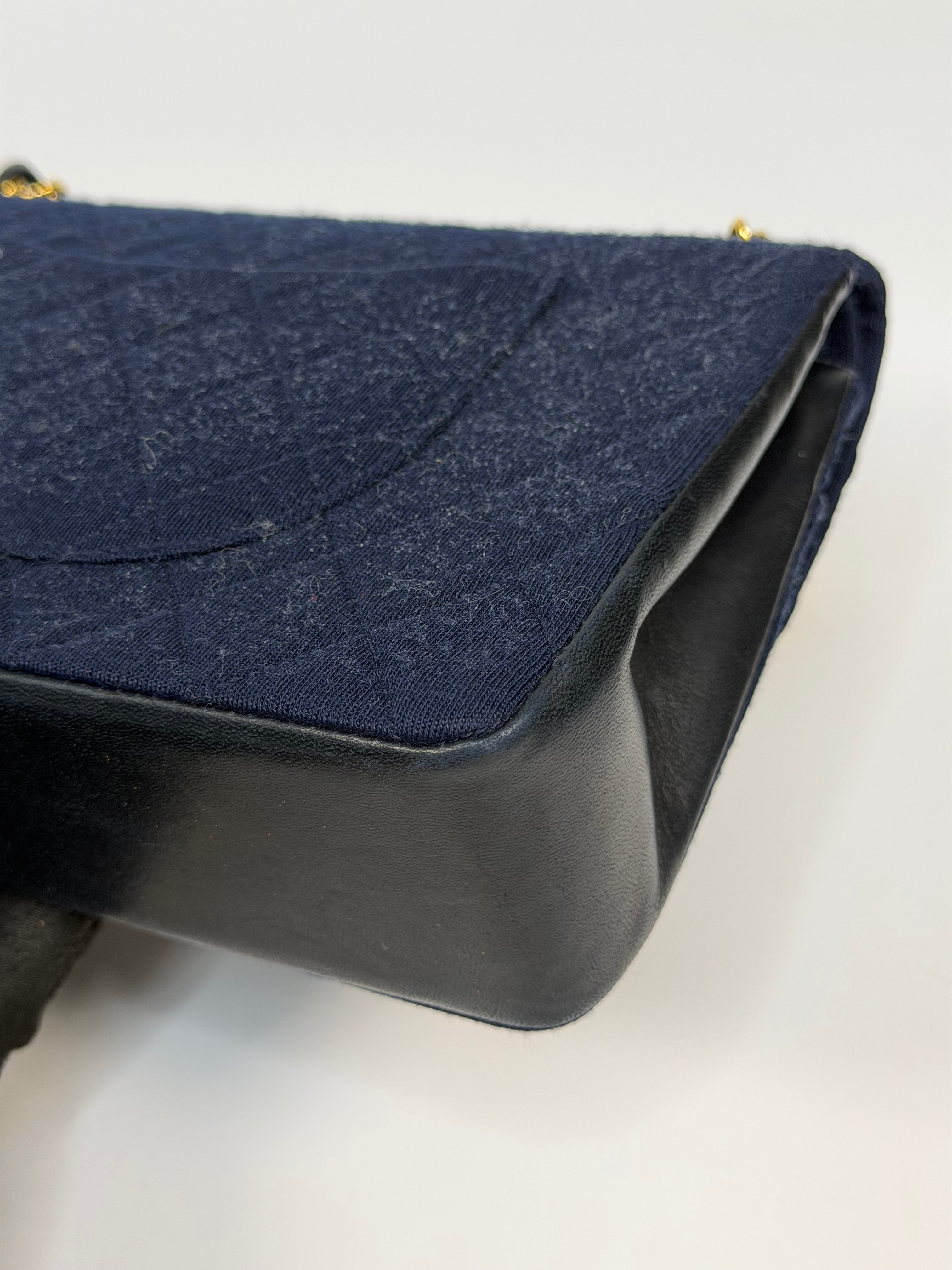Chanel Vintage Medium Double Flap Navy Cotton With 24Kt Gold Hardware. Authentic and preloved in excellent condition.