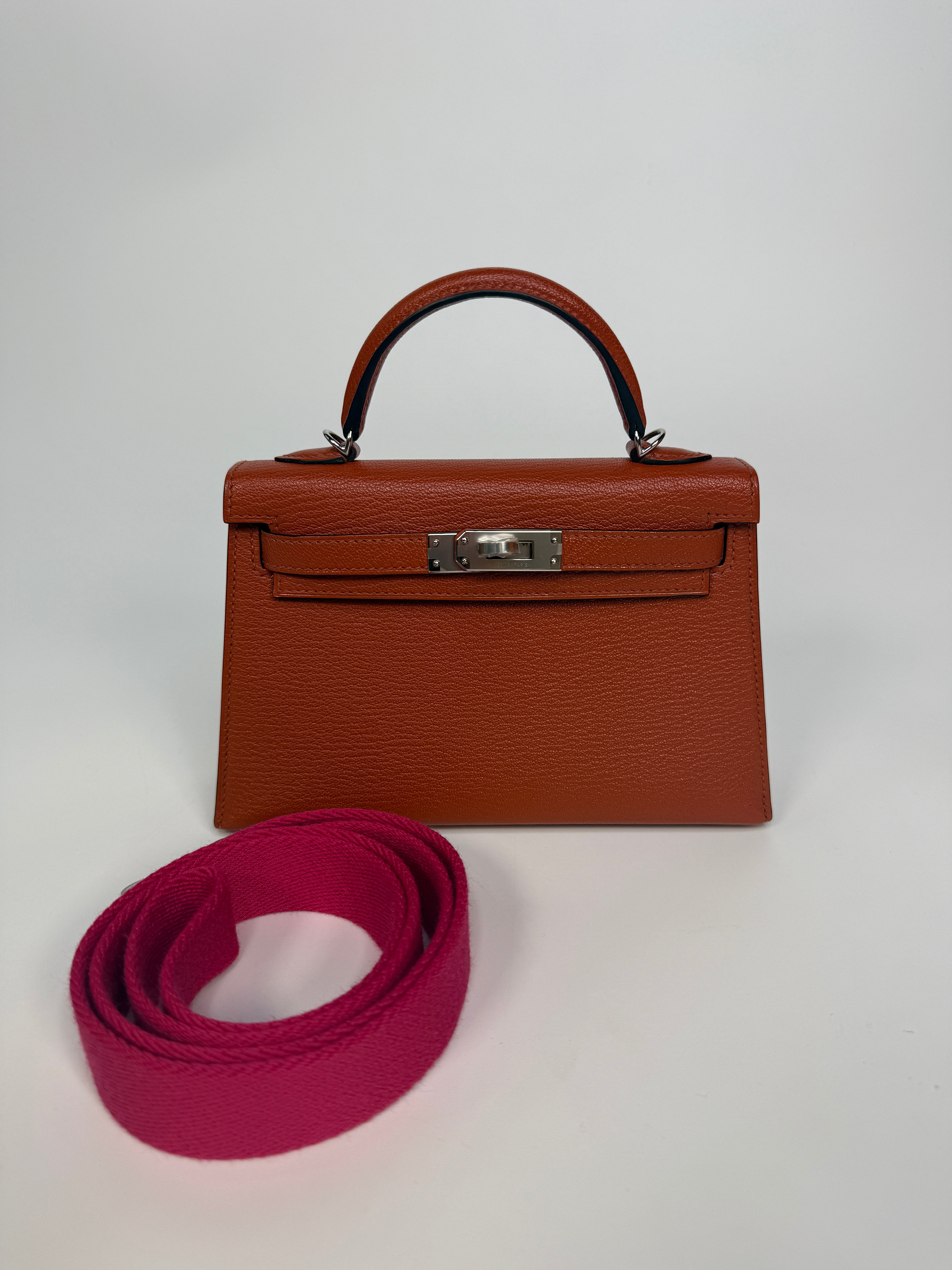Hermès Mini Kelly In Cuivre Chèvre Mysore Leather With Palladium Hardware. Authentic and preloved in new and unused condition