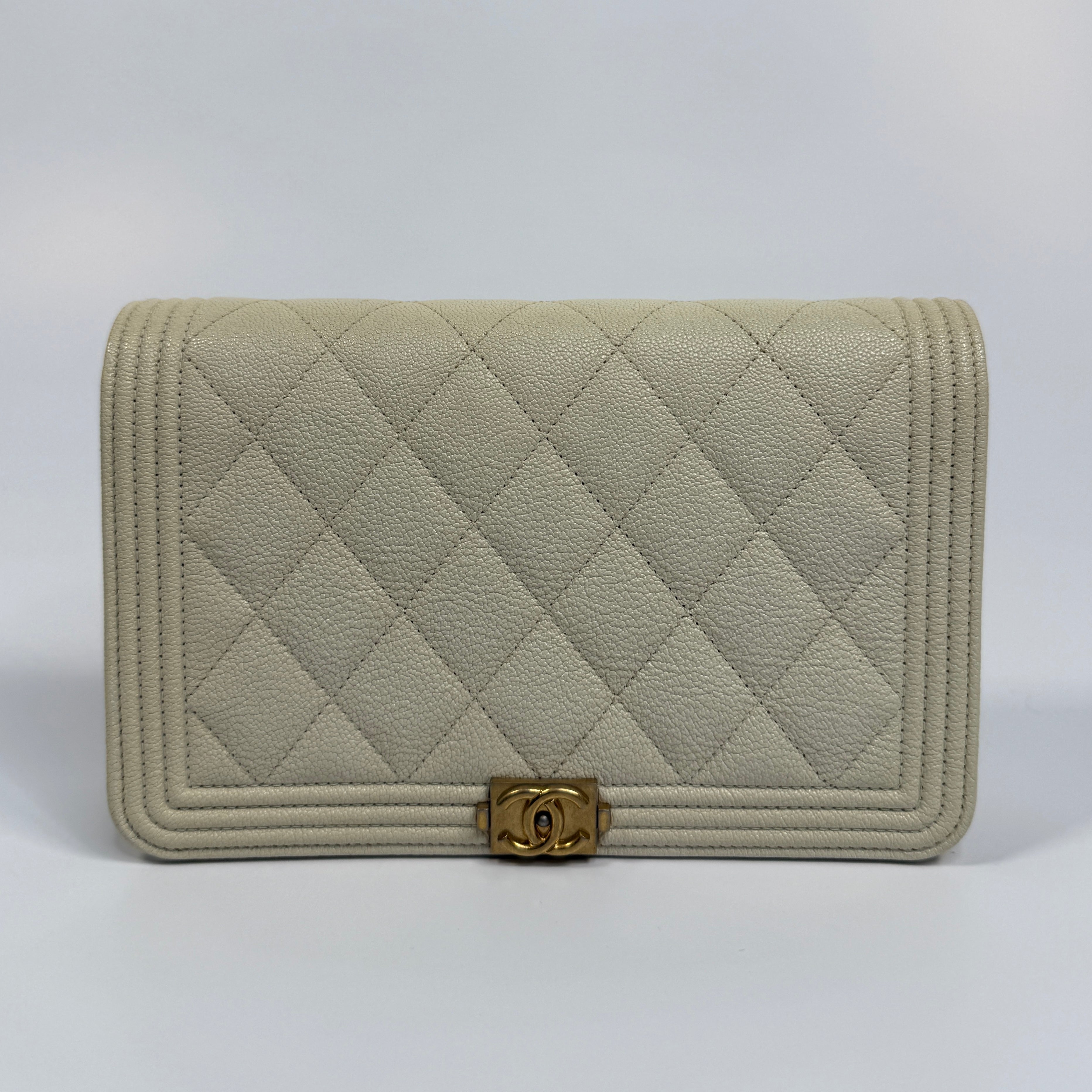 Authentic and pre loved Chanel Boy Wallet On Chain In White Caviar Leather With Gold Hardware. Excellent Condition