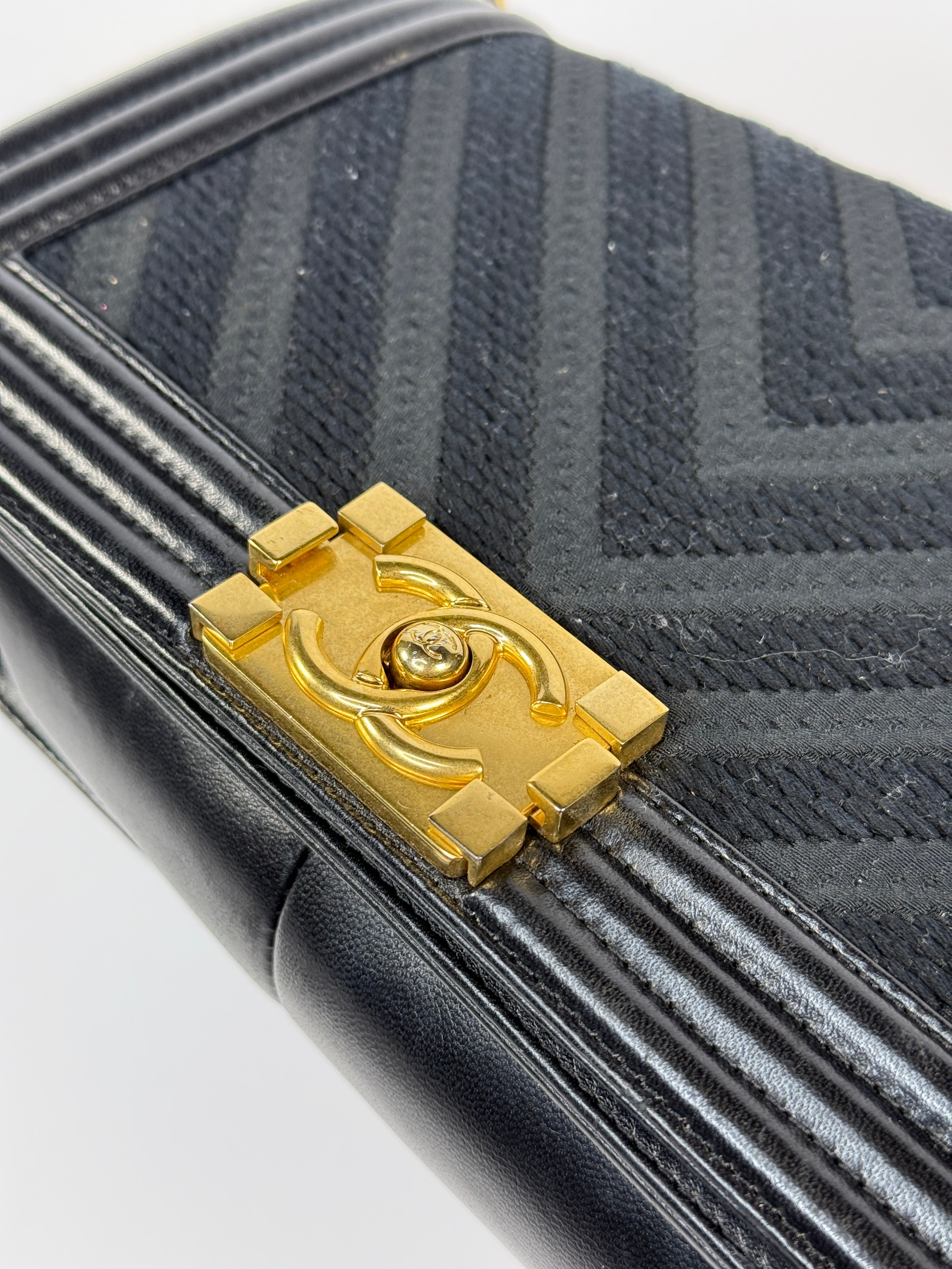 Chanel Black Chevron Fabric & Lambskin Leather Medium Boy Bag With Gold Hardware. Very Good Condition. Authentic and preloved. 