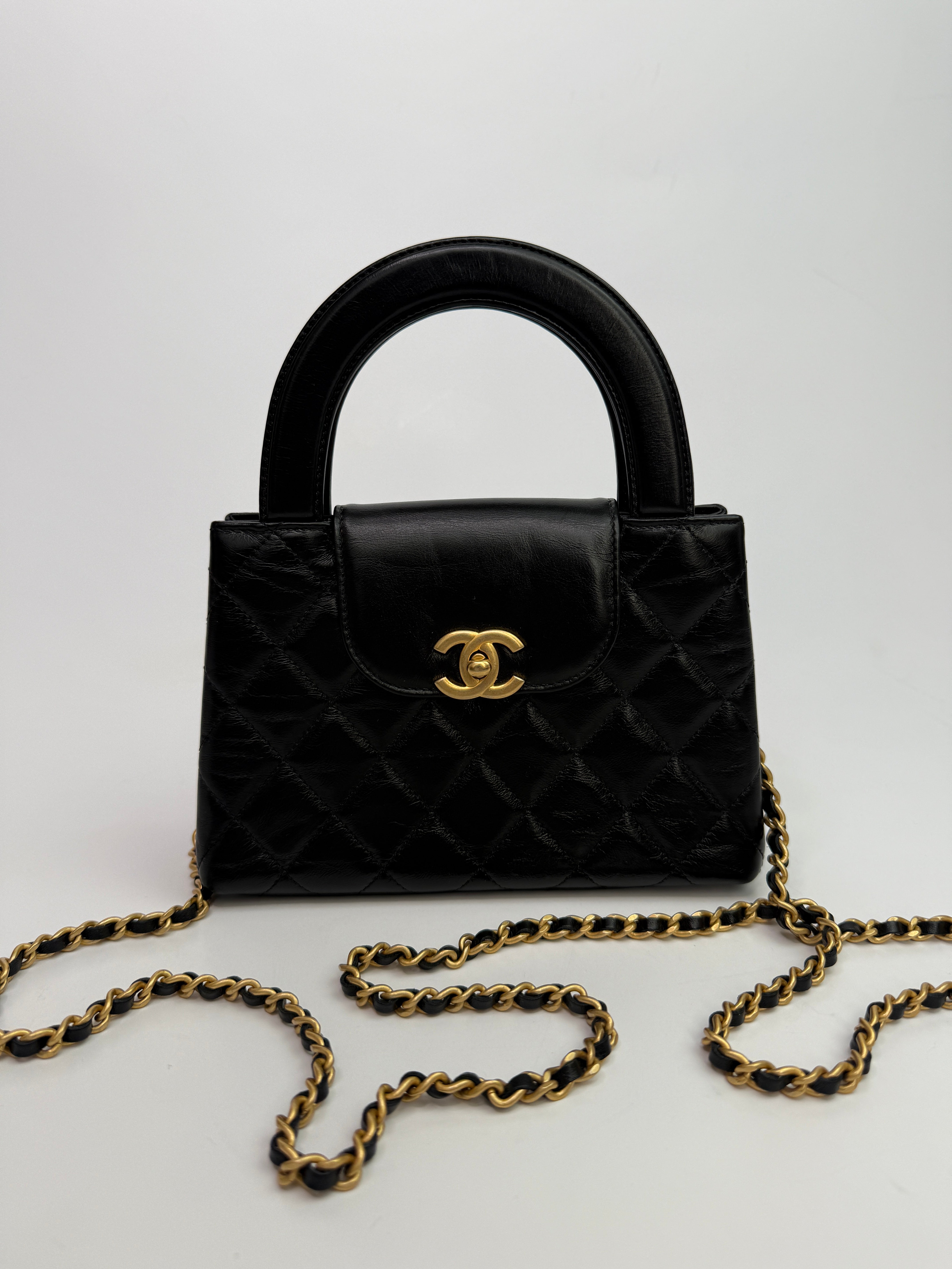 Chanel Mini Kelly Bag In Black Calfskin Leather with Gold Hardware
Pre Loved & Authentic 