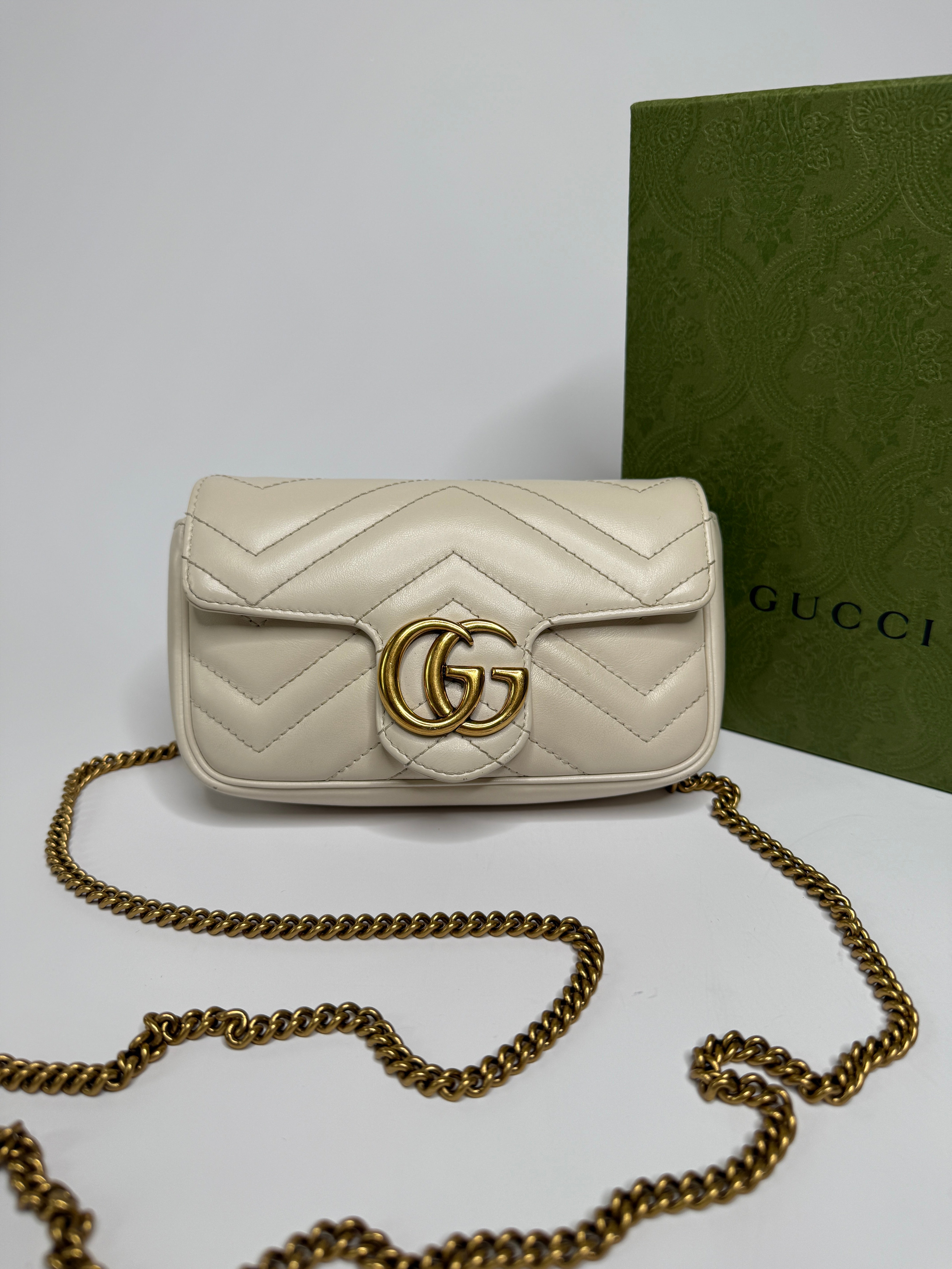 Gucci Marmont White  Matelassé Super Mini Bag With Gold Hardware In Excellent pre loved condition. Authentic and preloved
