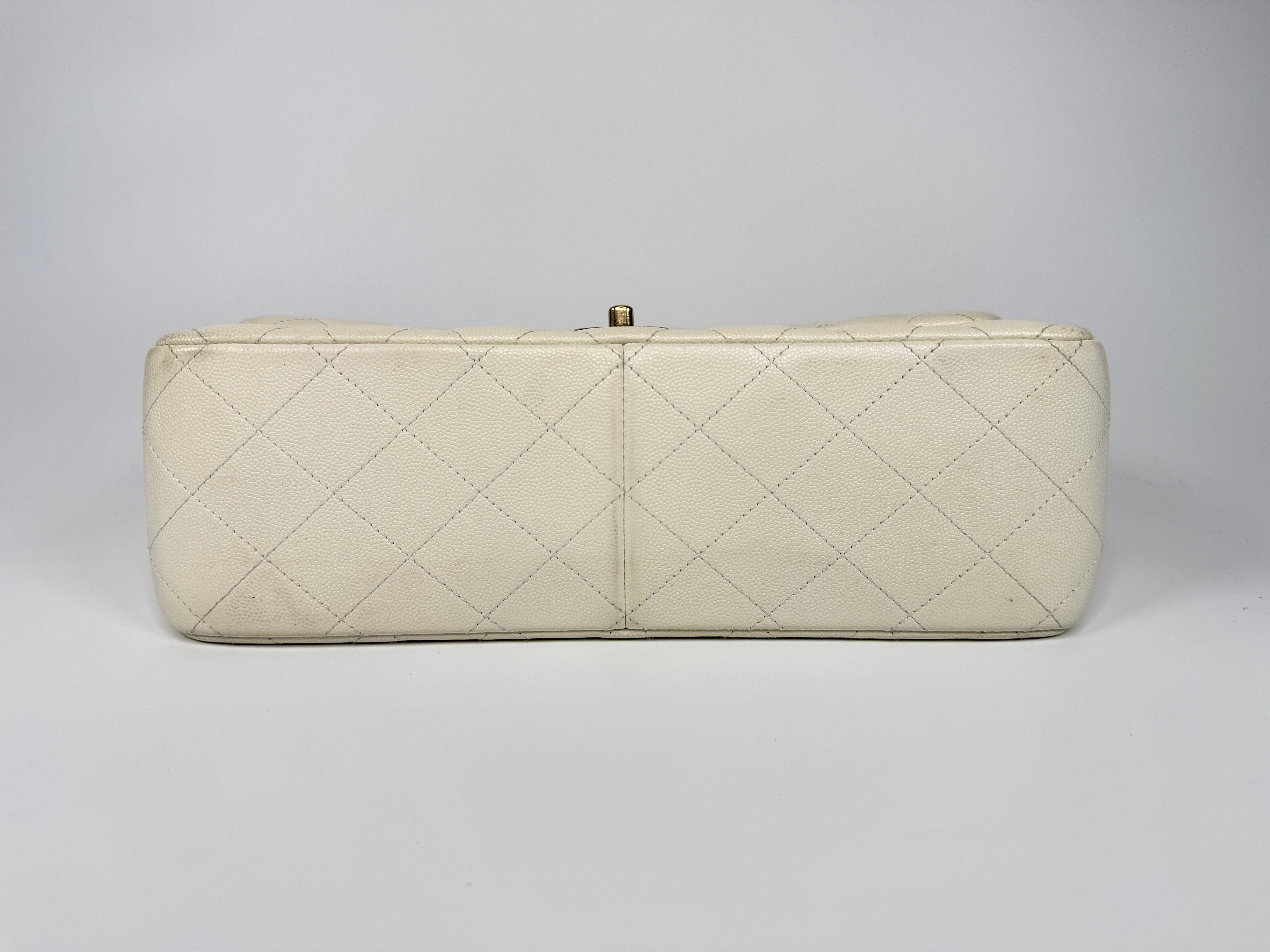 Authentic pre-loved Chanel Classic Jumbo Flap Bag In White Caviar Leather With pale gold  hardware in very good condition. Verified by Luxe Cheshire. International, fast  and fully insured delivery. Trusted designer resale.