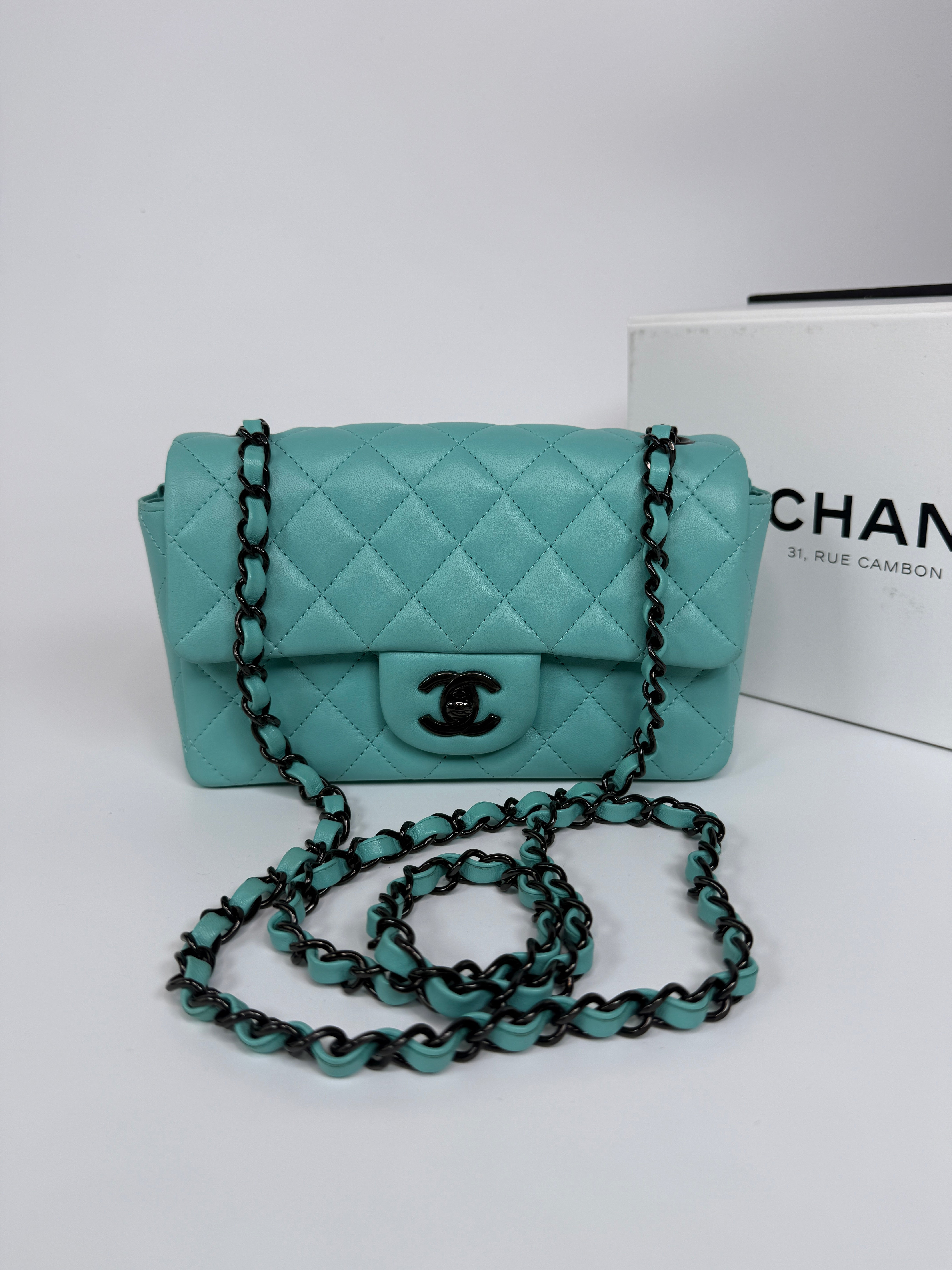 Authentic and preloved Chanel Mini Rectangle Flap Bag In Turquoise Lambskin Leather With Gunmetal Hardware In Excellent condition. Verified by Luxe Cheshire. 100% Authenticity Guarantee. 