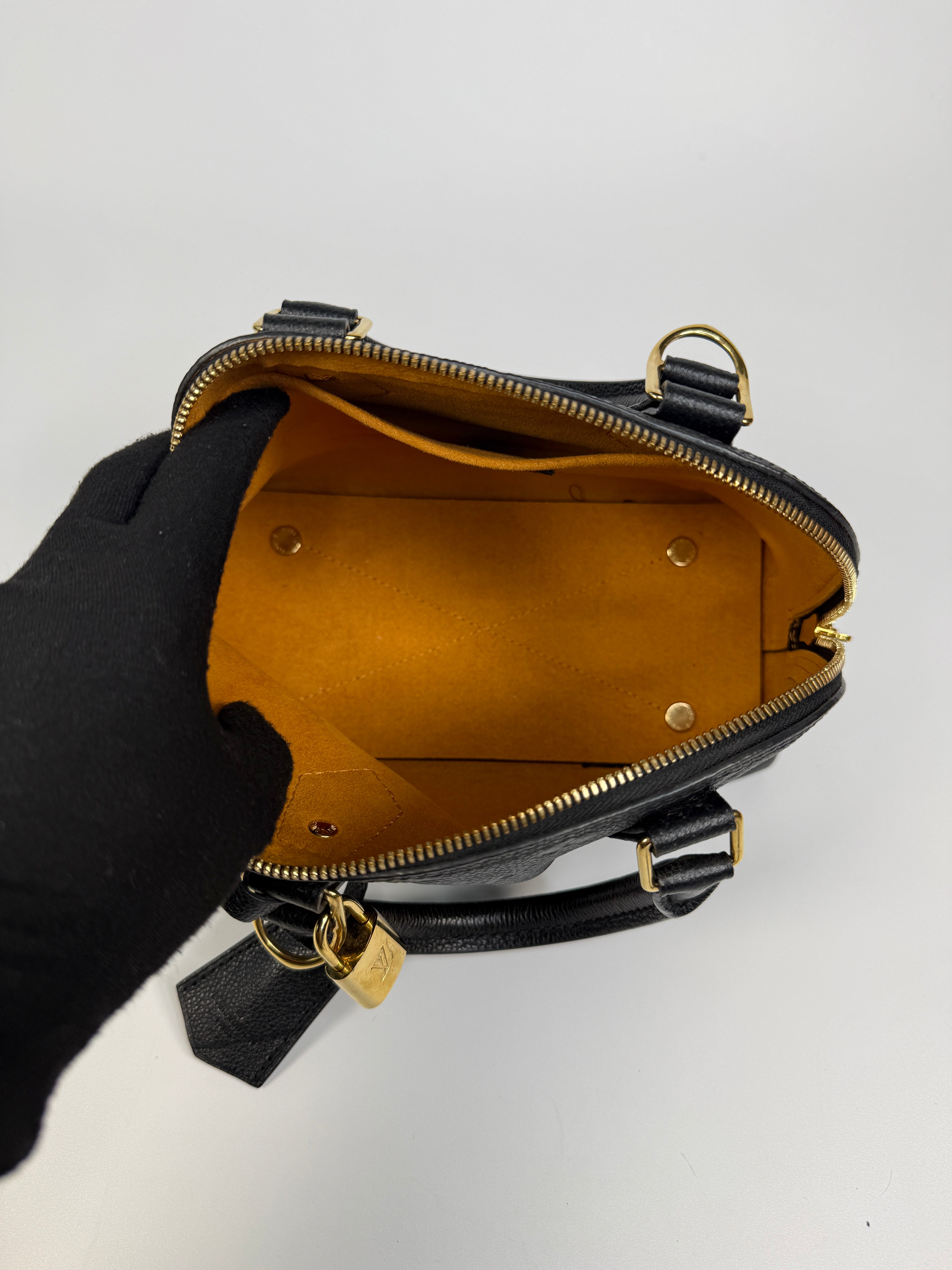 Authentic and preloved Louis Vuitton Alma BB In Empreinte Black Monogram With Gold Hardware
