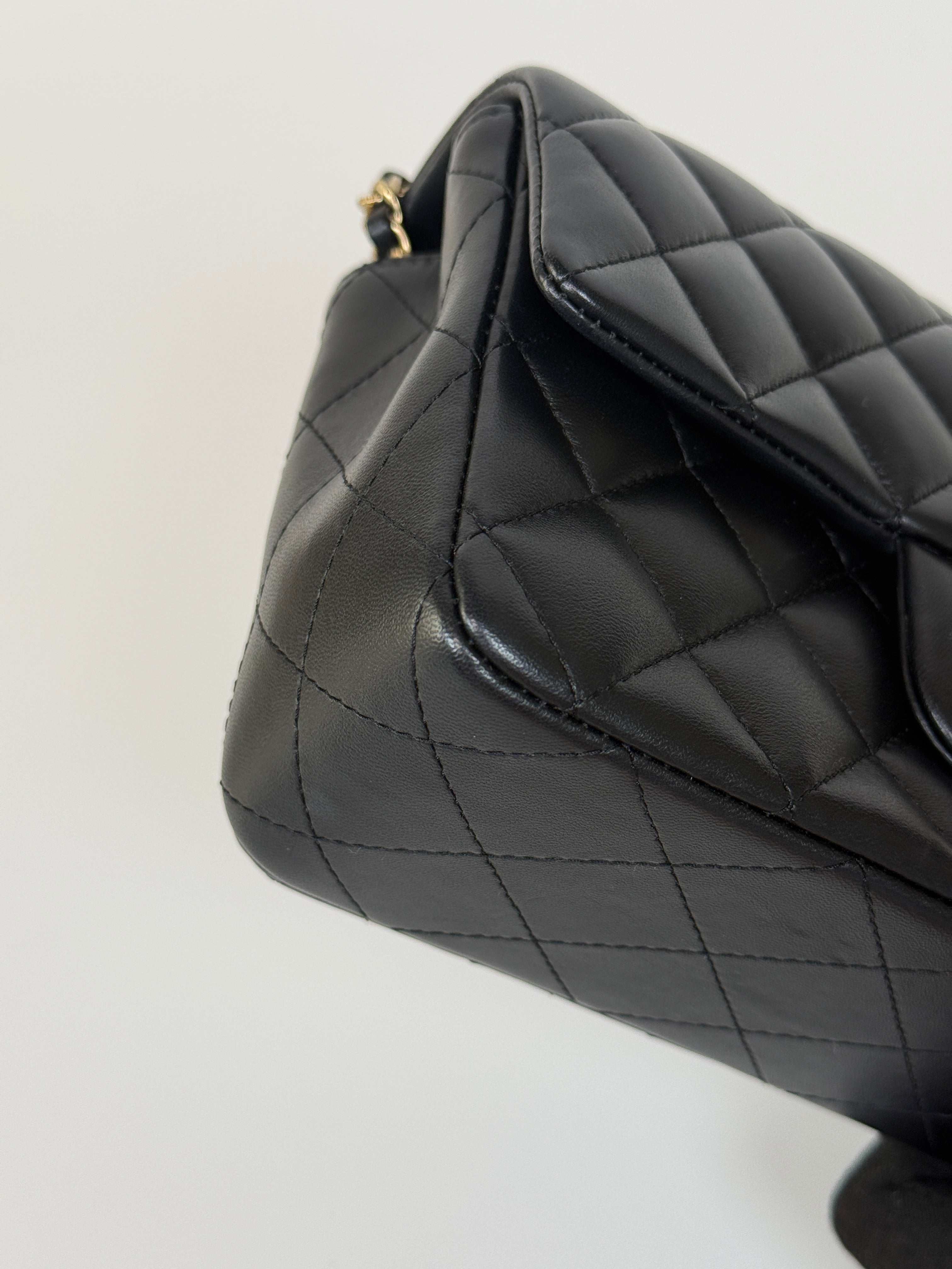 Authentic and preloved Chanel Mini Rectangle Top Handle Flap Bag In Black Lambskin With Gold hardware. Excellent Condition. 100% Authenticity guarantee 