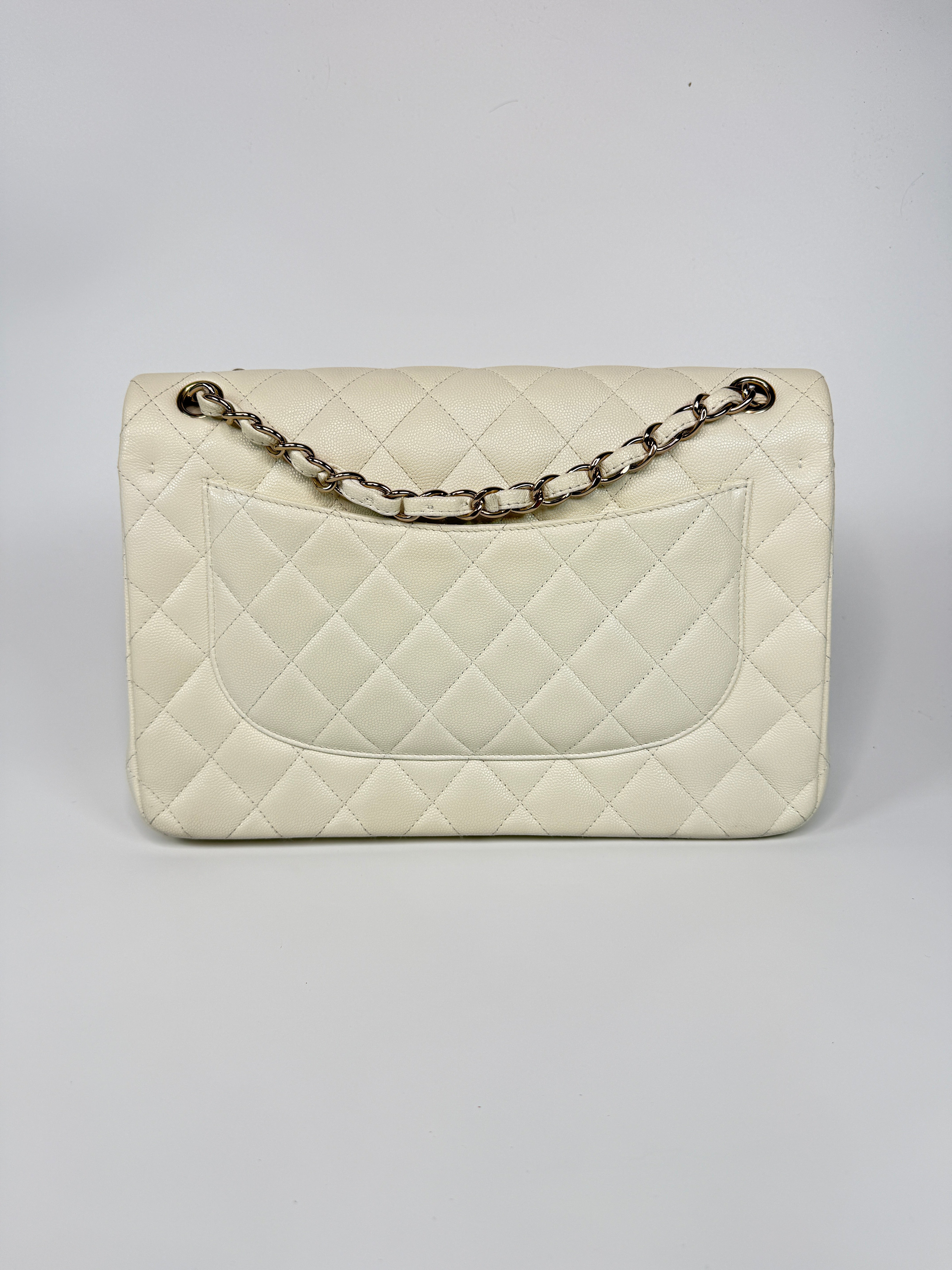 Authentic pre-loved Chanel Classic Jumbo Flap Bag In White Caviar Leather With pale gold  hardware in very good condition. Verified by Luxe Cheshire. International, fast  and fully insured delivery. Trusted designer resale.