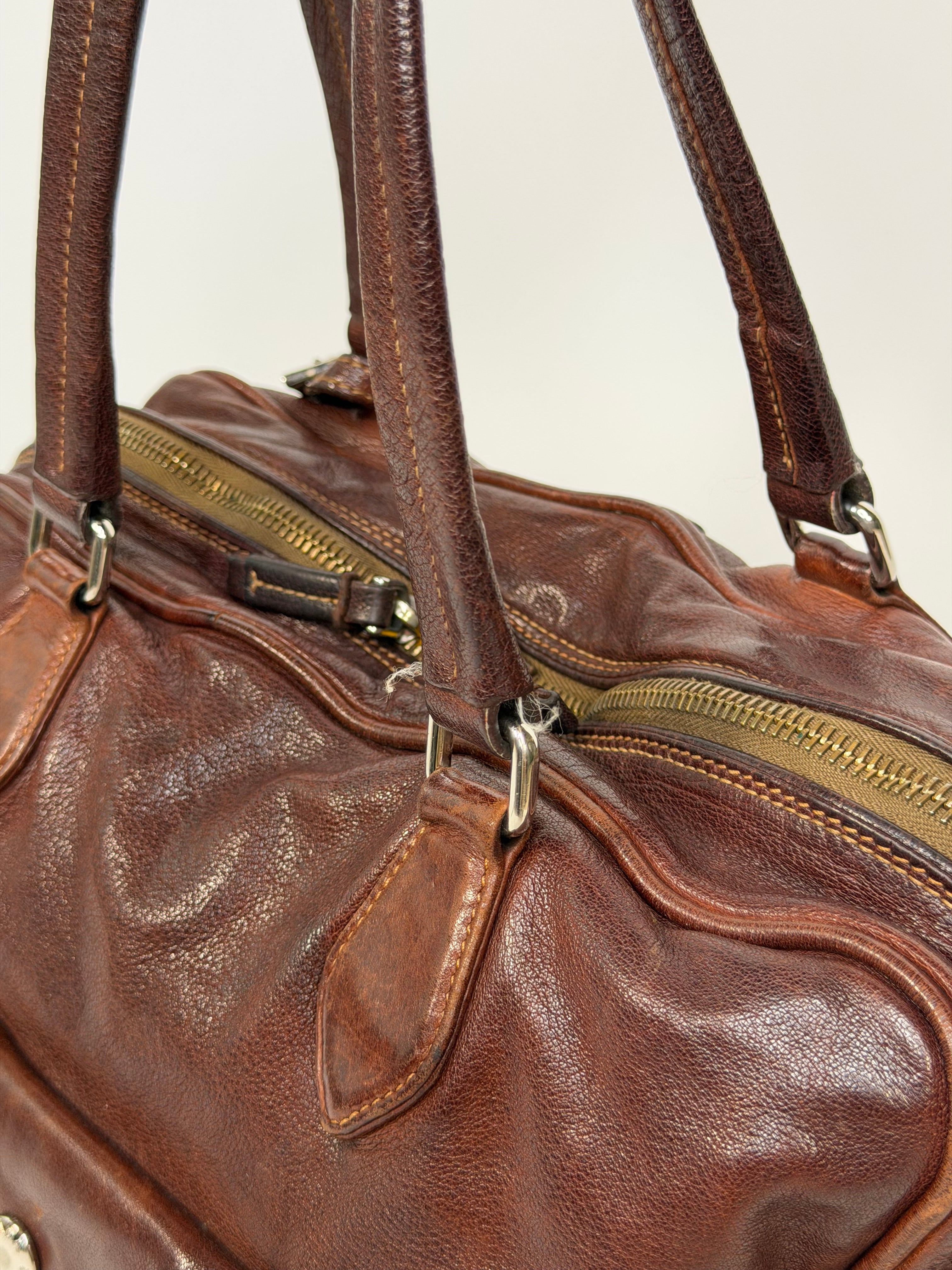 Prada Washed Bauletto Shoulder Bag In Brown Leather With Gold Hardware. Authentic and preloved in very good condition