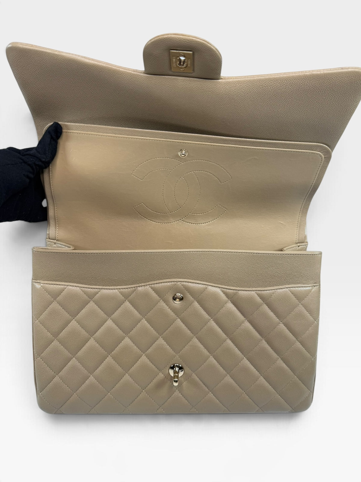 Chanel Maxi Flap In Beige Caviar Leather With Gold Hardware. 100% authentic and pre loved in excellent condition. 