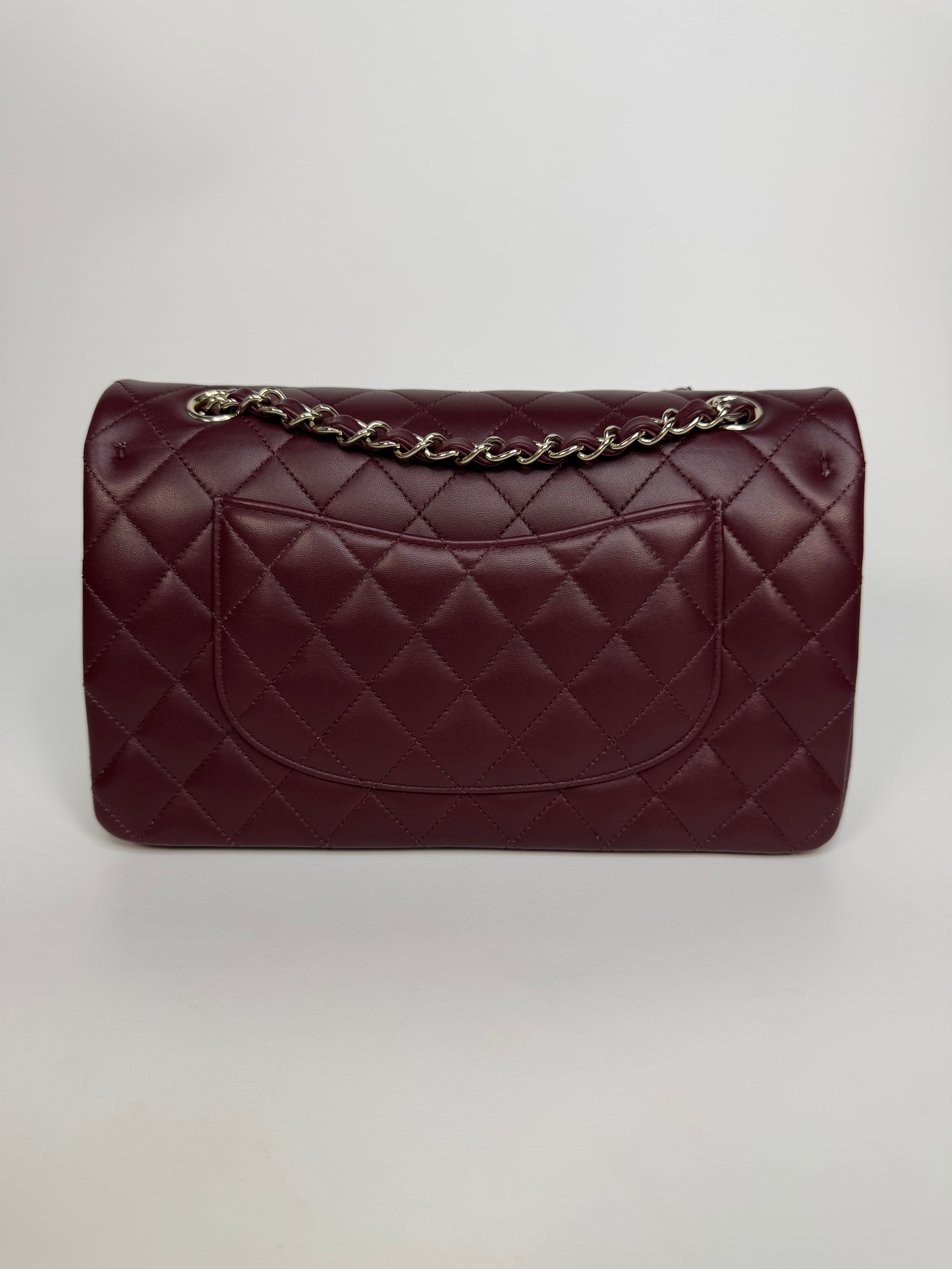 Chanel Medium Classic Double Flap Burgundy Lambskin Leather With Pale Gold Hardware. Authentic and preloved in excellent condition with 100% authenticity guarantee.