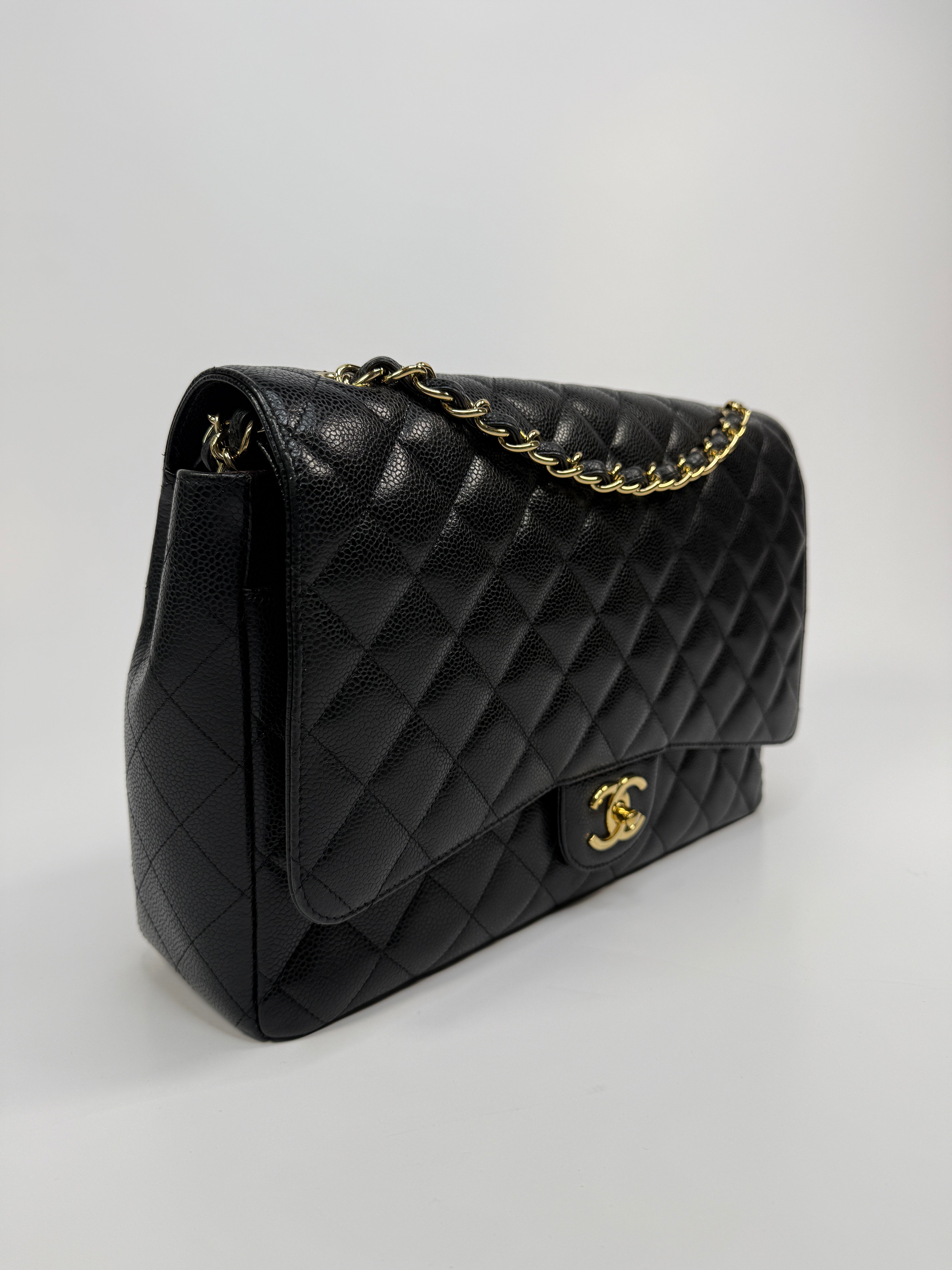 Chanel Maxi Classic Double Flap In Black Caviar Leather With Gold Hardware
Pre Loved & Authentic 