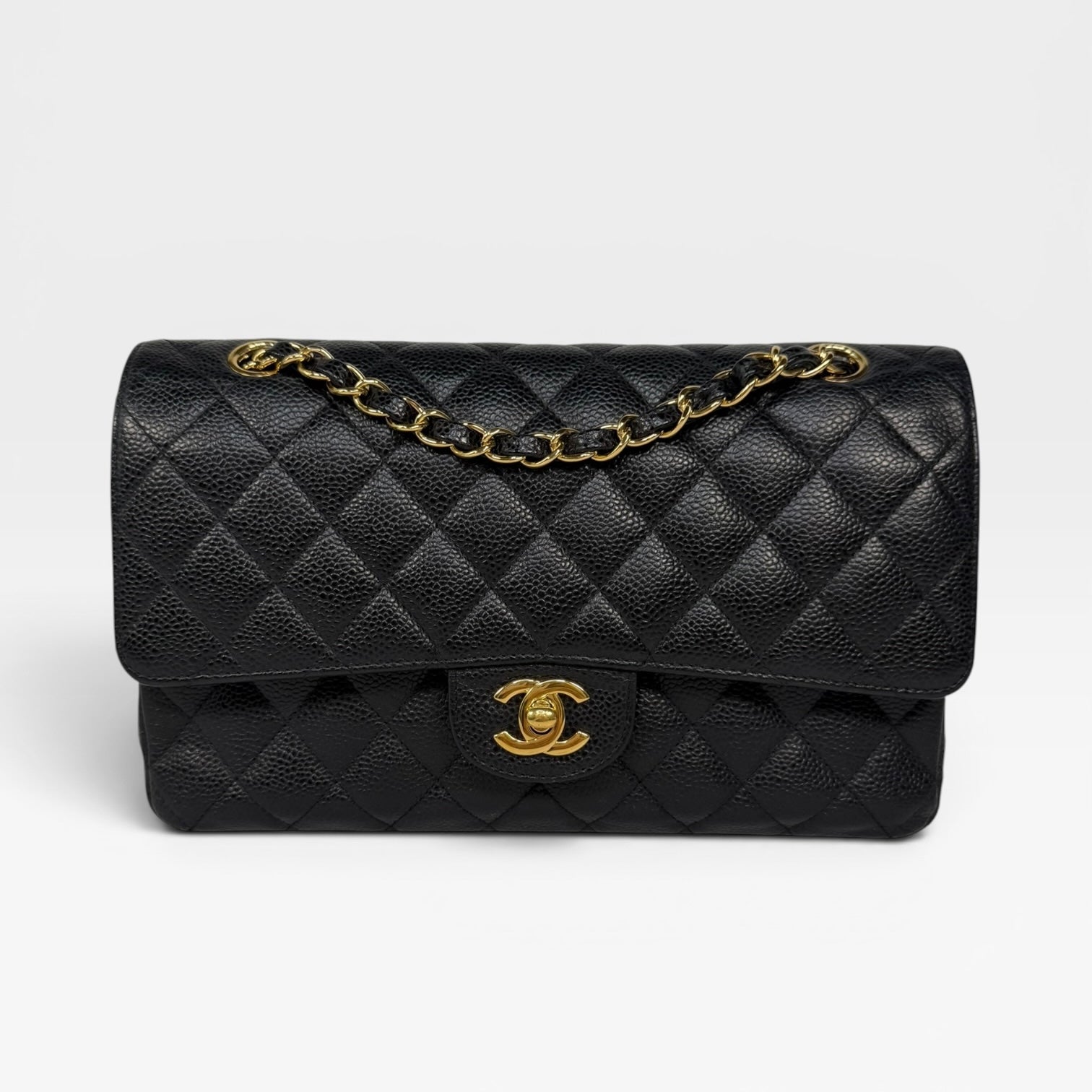 Chanel Medium Classic Double Flap In Black Caviar Leather Gold Hardware. 100% authentic and preloved in excellent condition