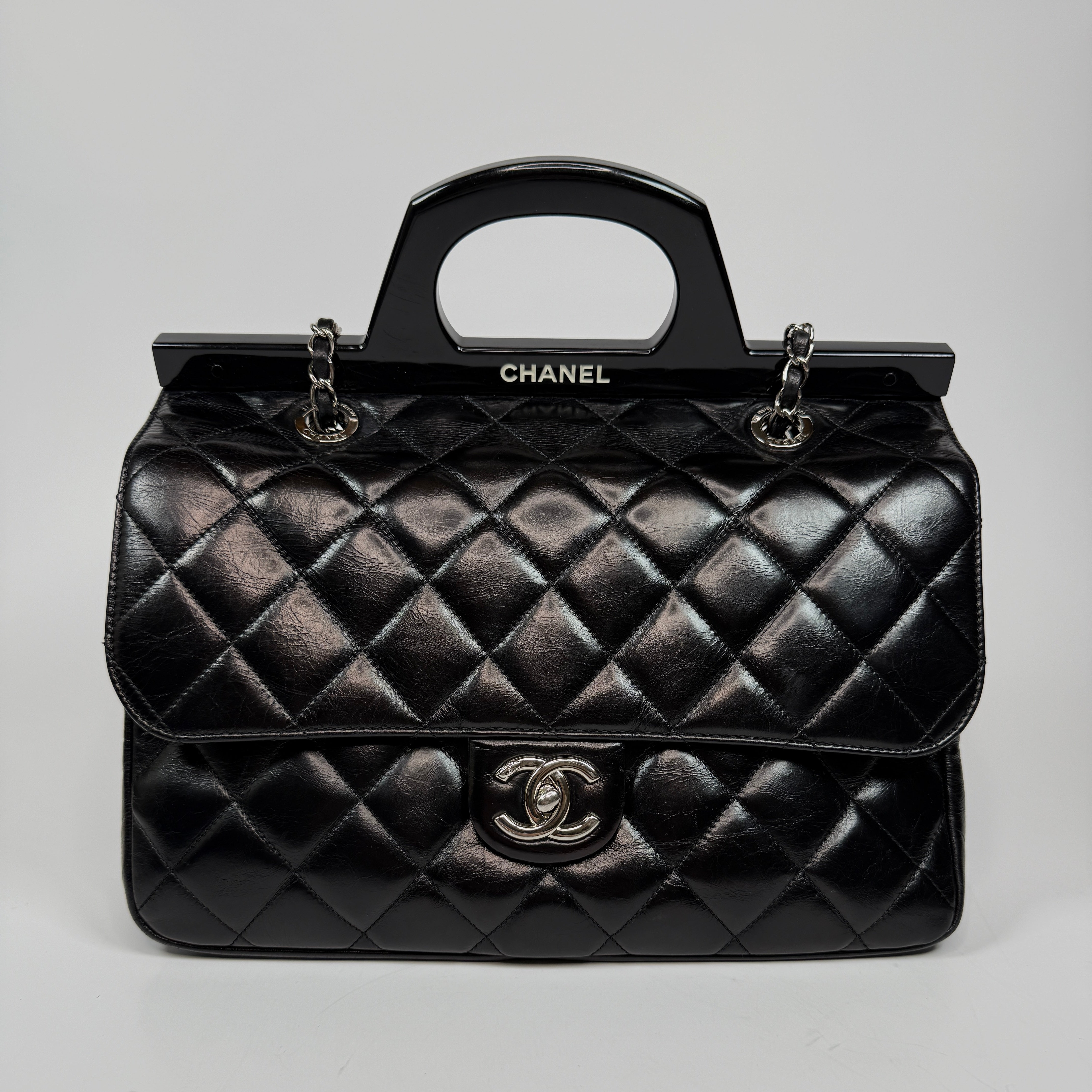 Chanel Delivery Top Handle Flap Bag In Black Calfskin Leather With Silver hardware in very good condition Authentic and preloved 