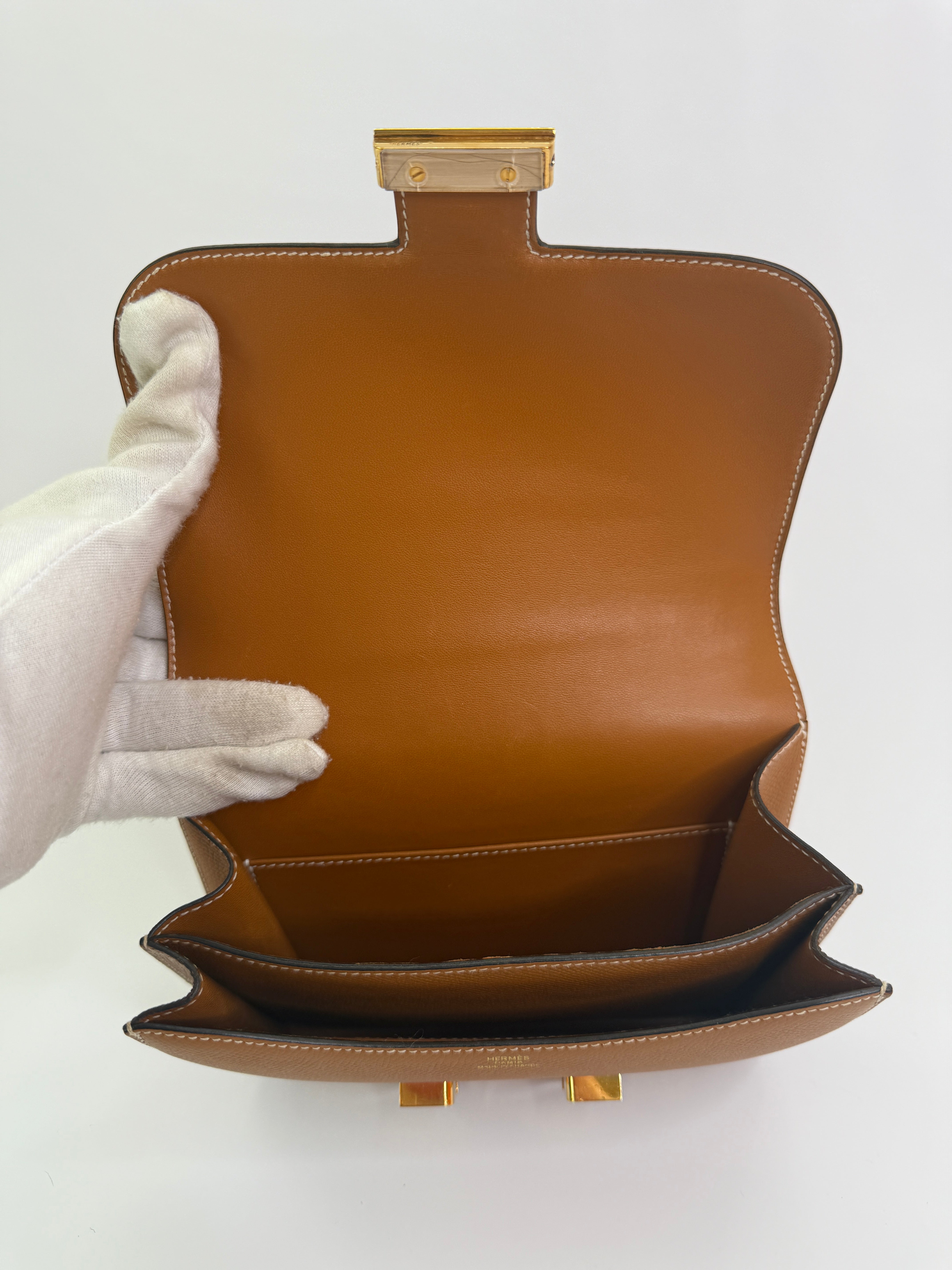 Authentic pre-lovedHermès Constance 18 In Toffee Epsom Leather With Gold Hardware. 