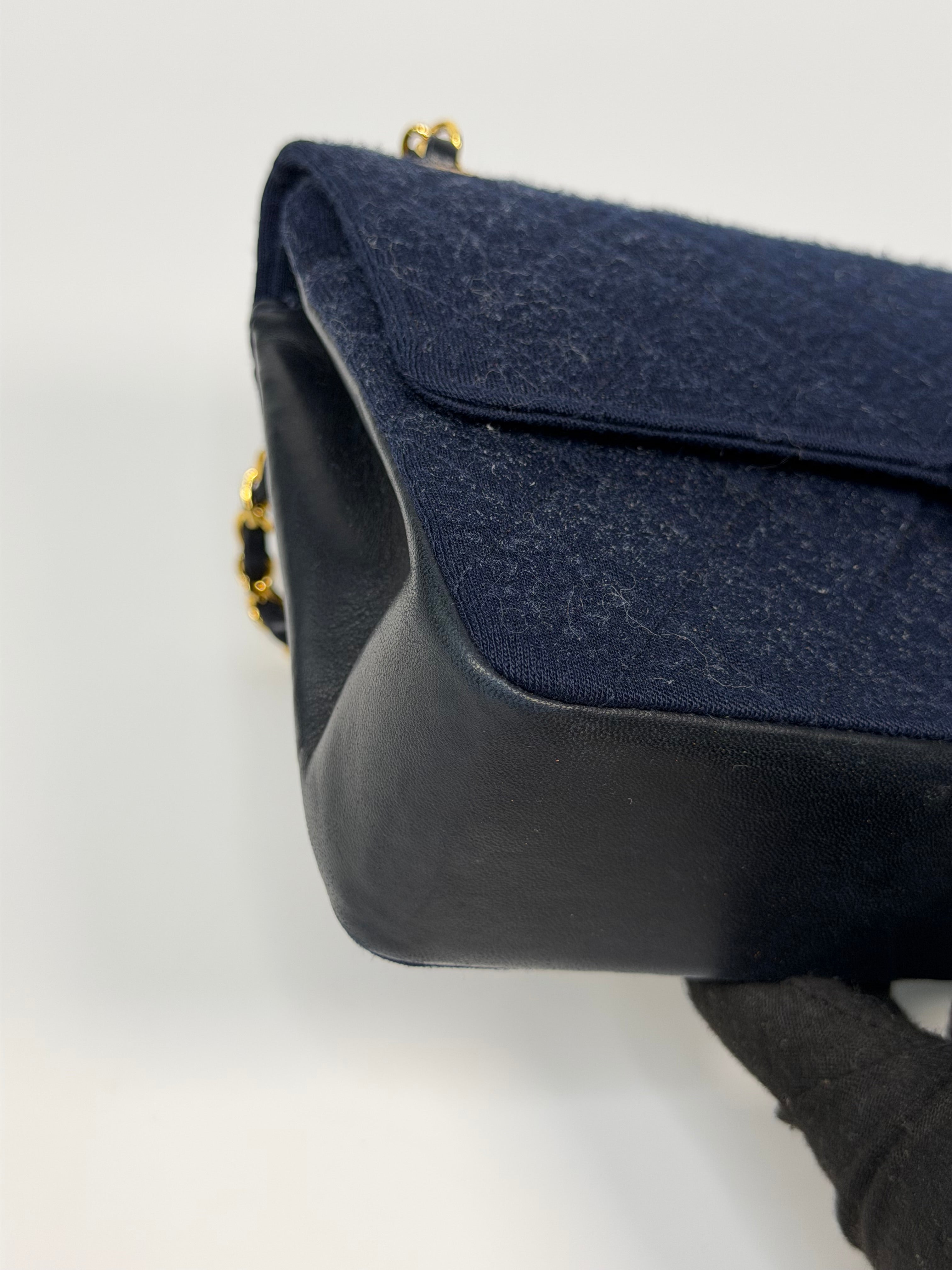 Chanel Vintage Medium Double Flap Navy Cotton With 24Kt Gold Hardware. Authentic and preloved in excellent condition.