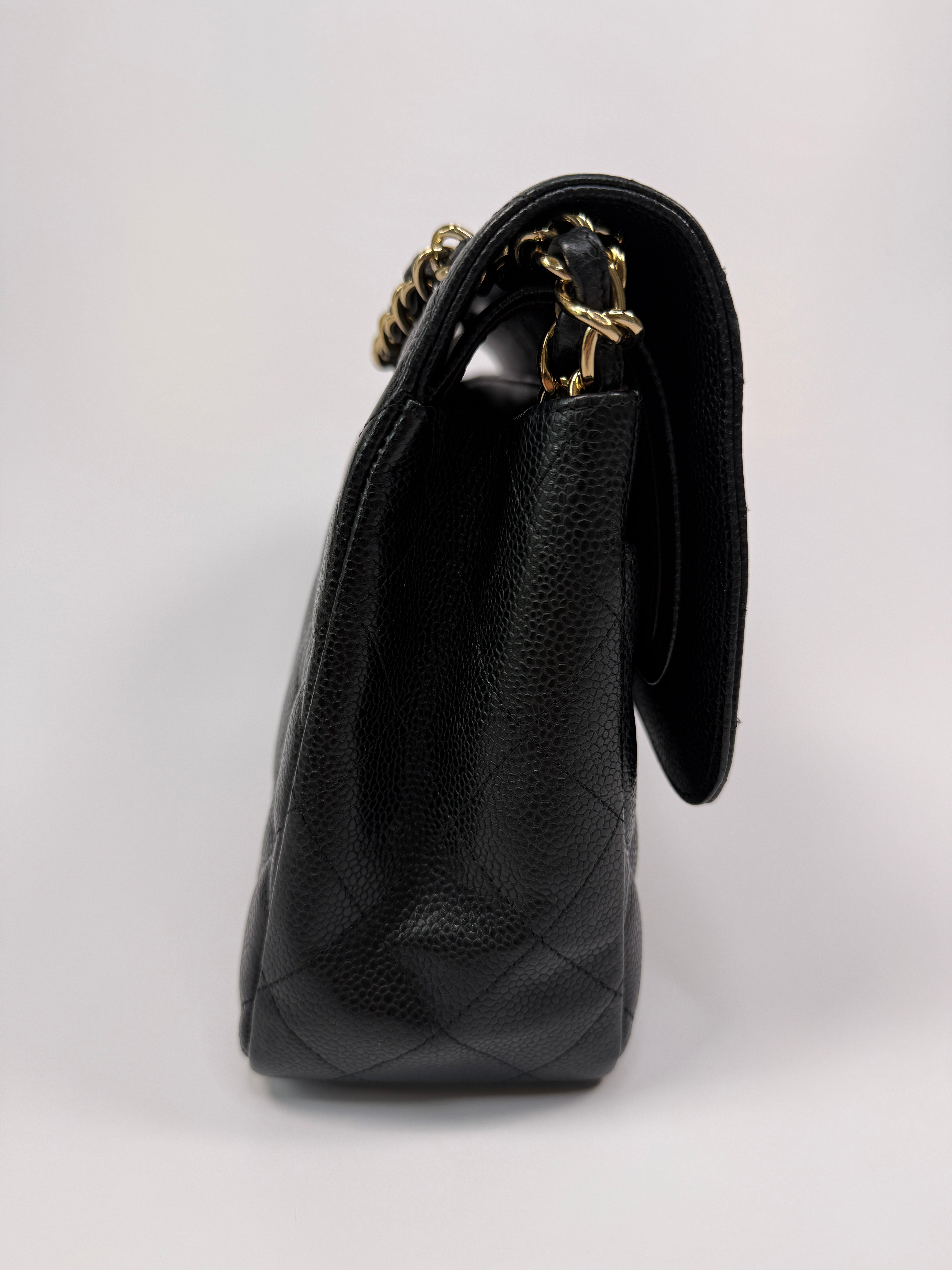 Chanel Classic Jumbo Flap Bag In Black Caviar LeatherWith Gold Hardware
Pre Loved & Authentic 