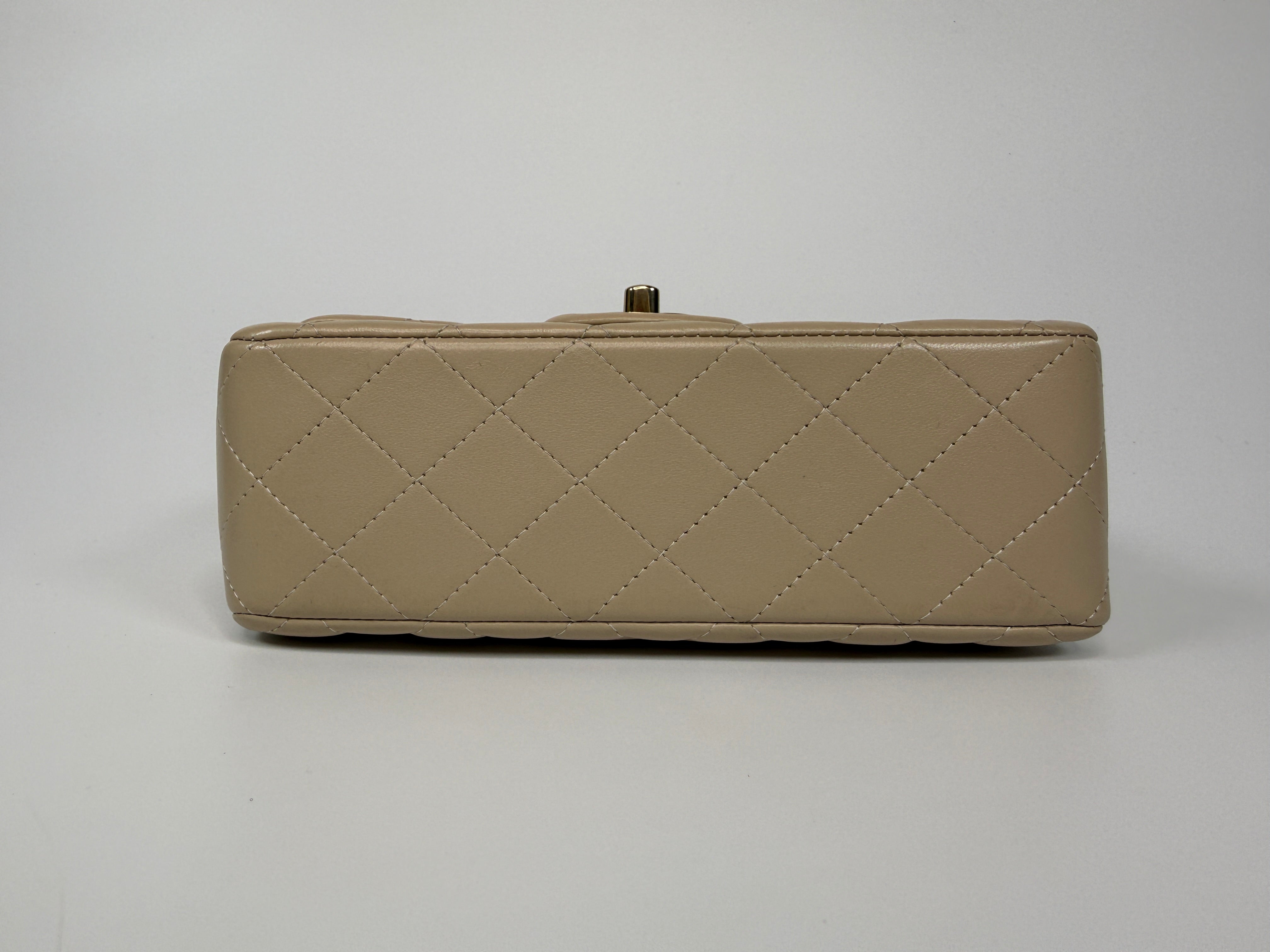Authentic and preloved Chanel Mini Rectangle Top Handle In Ecru Lambskin With Gold Hardware in excellent condition, Fully insured next day delivery. Verified by Luxe Cheshire. 100% Authenticity guarantee,