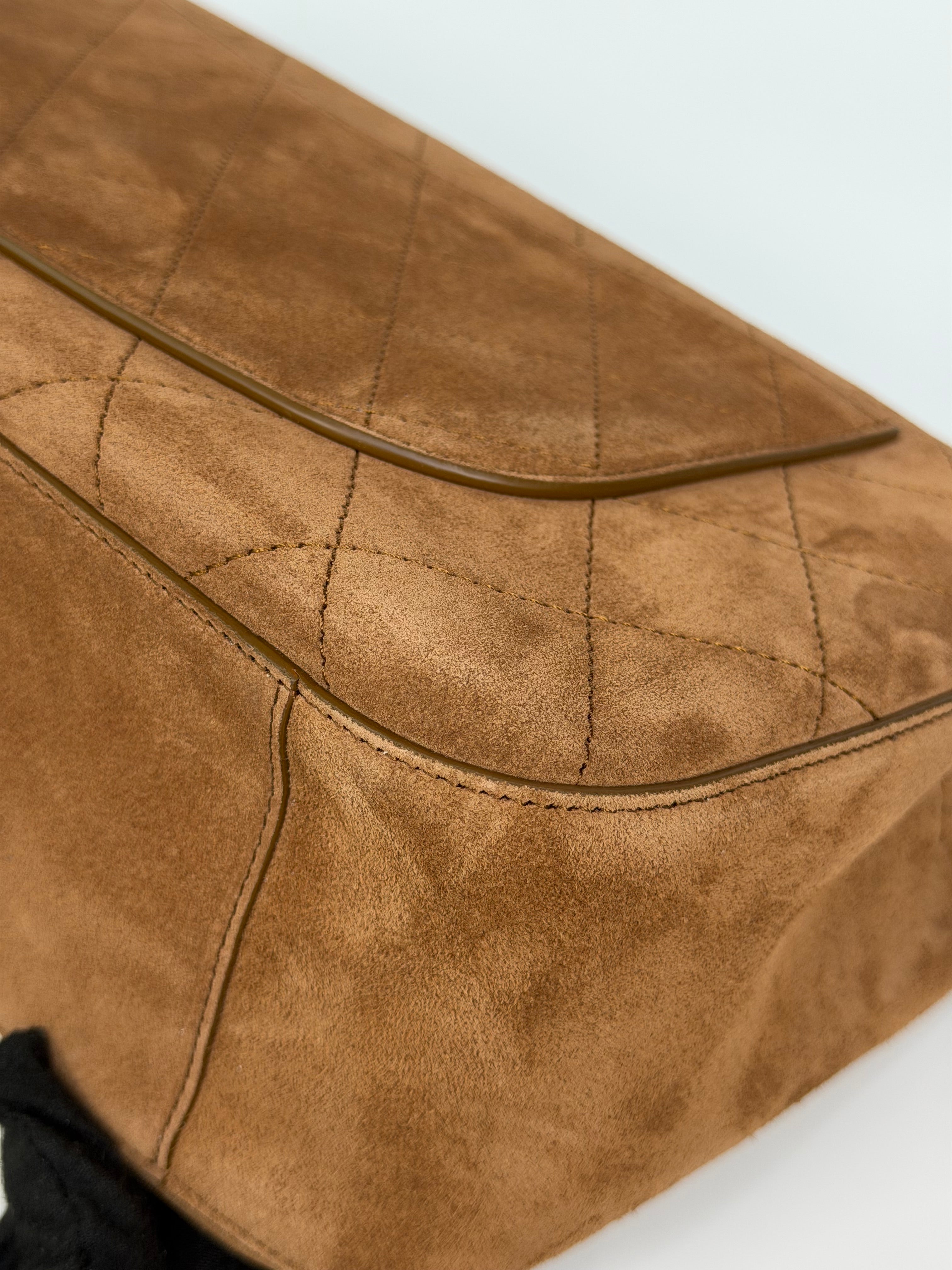 Chanel Maxi Flap In Tan Suede With Gold Hardware. Authentic and preloved in new and unused condition.