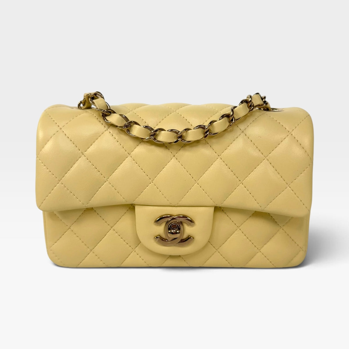 Chanel Mini Rectangle In Yellow Lambskin Leather With Gold Hardware. 100% authentic and preloved in excellent condition