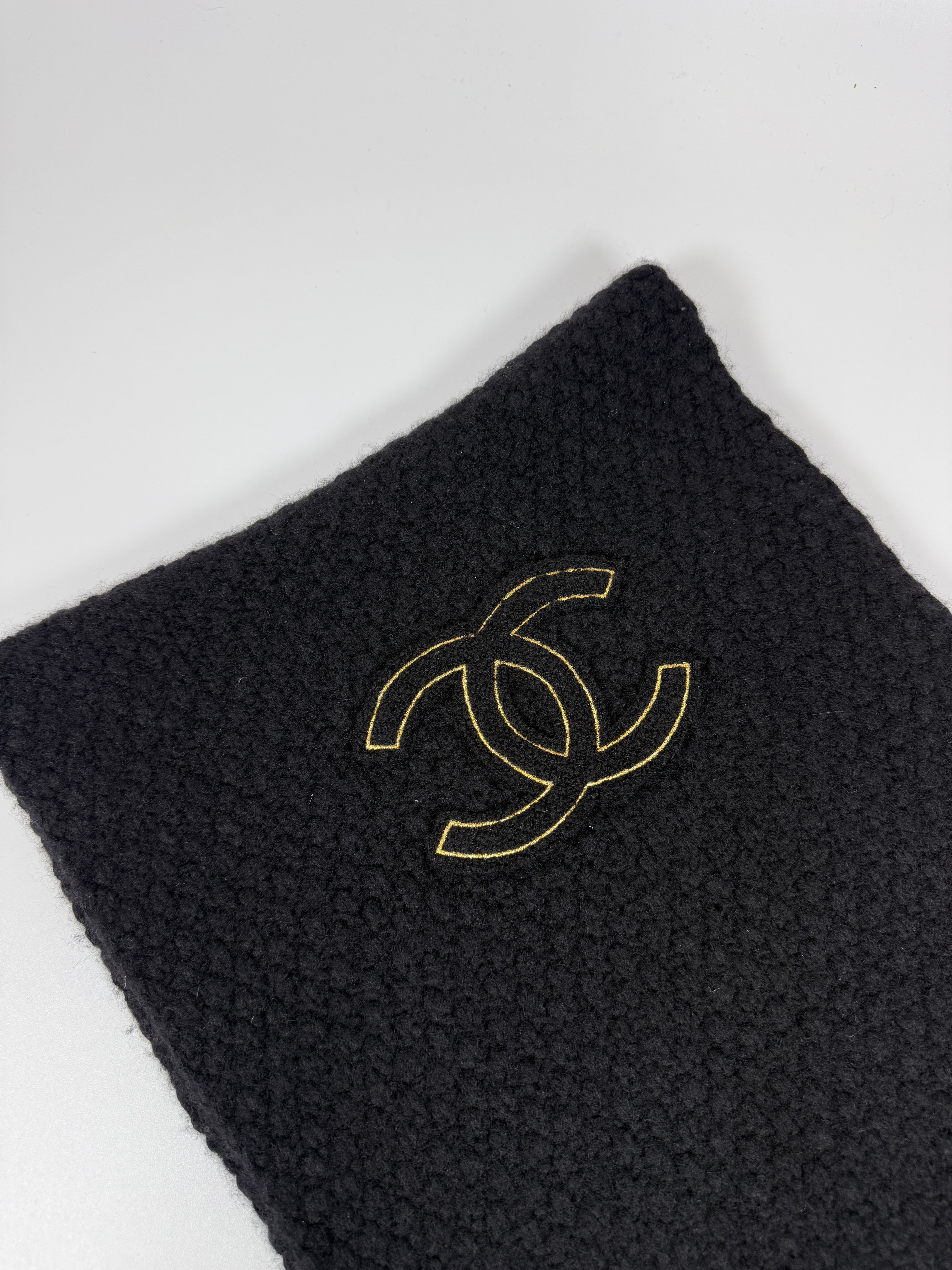 Authentic and preloved Chanel Black Knit Logo Scarf with cc logo. Excellent condition. 100% Authenticity guarantee 